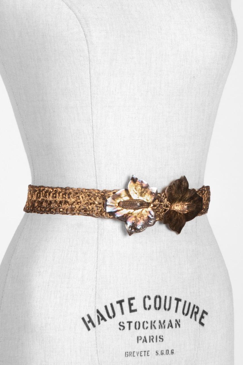Unique c. 1970s woven metal belt with leaf design buckle that can be worn as a very cool long necklace too (see picture 6).

The alluring artisanal belt features a double ivy or maple leaf buckle in a patinized gold tone metal symbolizing either