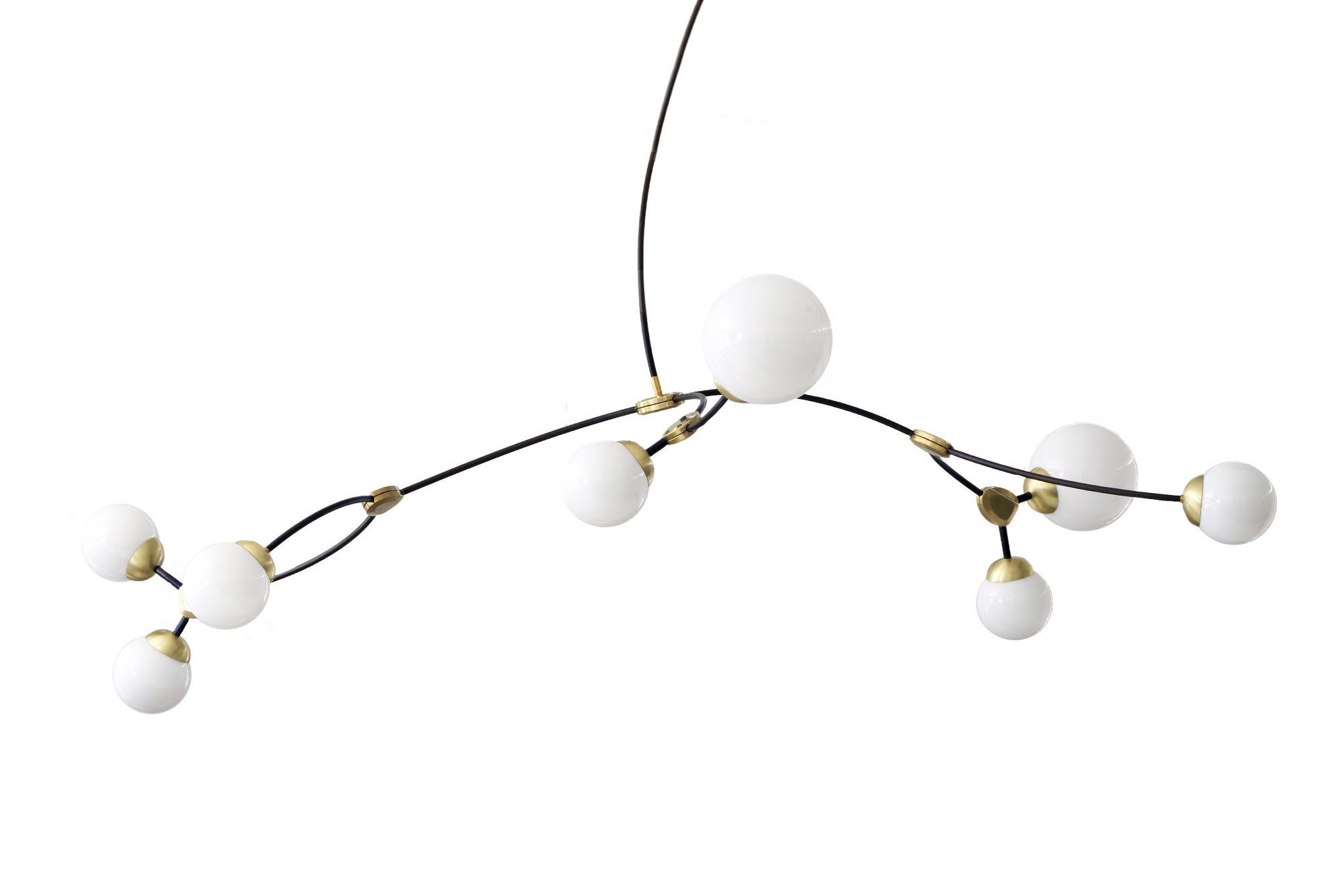 Ivy pendant 8 lamp by CTO Lighting
Materials: bronze with satin brass details and opal glass shades
Dimensions: H 42 x W 180 cm

All our lamps can be wired according to each country. If sold to the USA it will be wired for the USA for