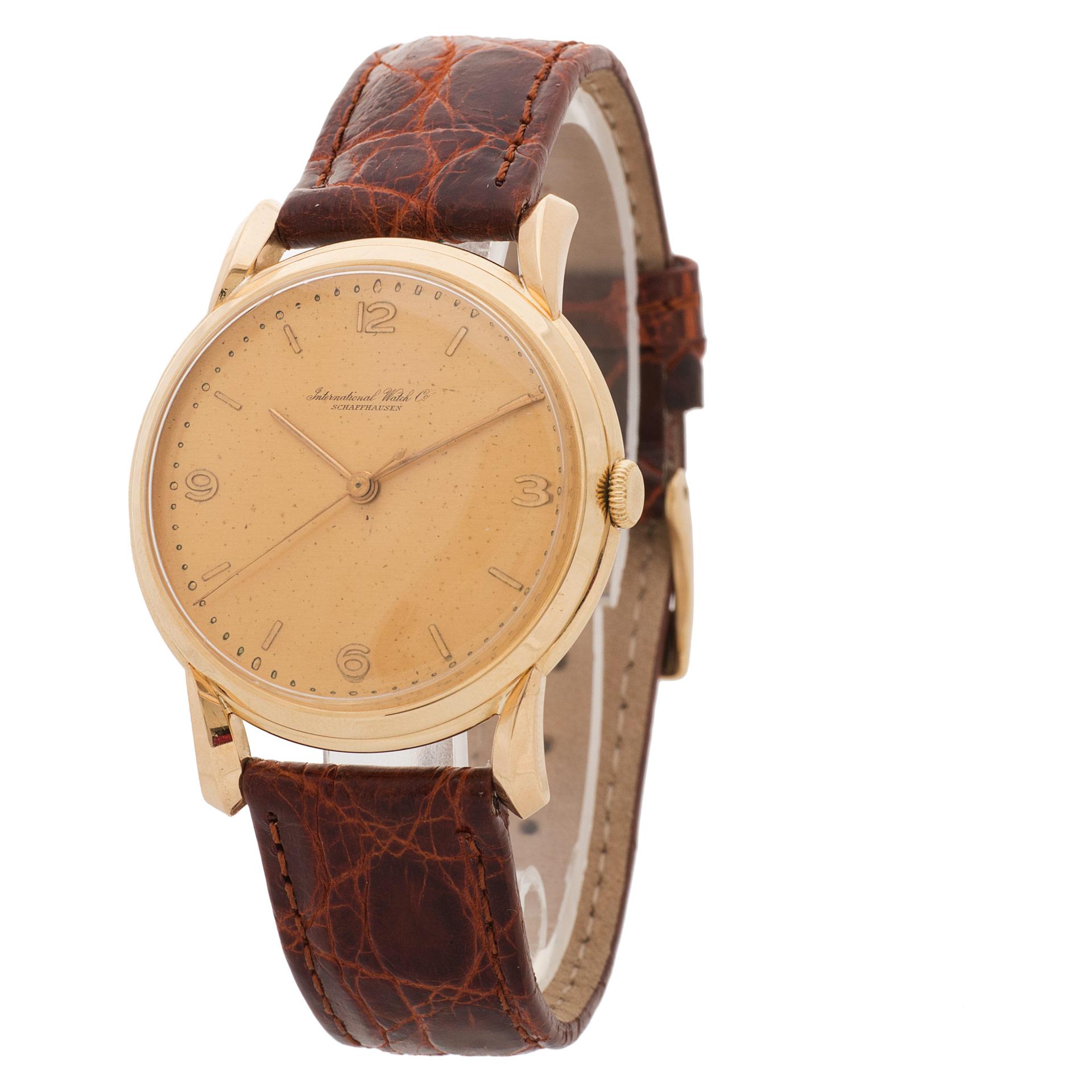 Vintage IWC Classic in 18k yellow gold on brown crocodile strap. Manual w/ sweep seconds. 36mm case size. Circa 1970s. Fine Pre-owned IWC Watch.   Certified preowned Classic IWC Classic watch is made out of yellow gold on a Brown Leather strap with