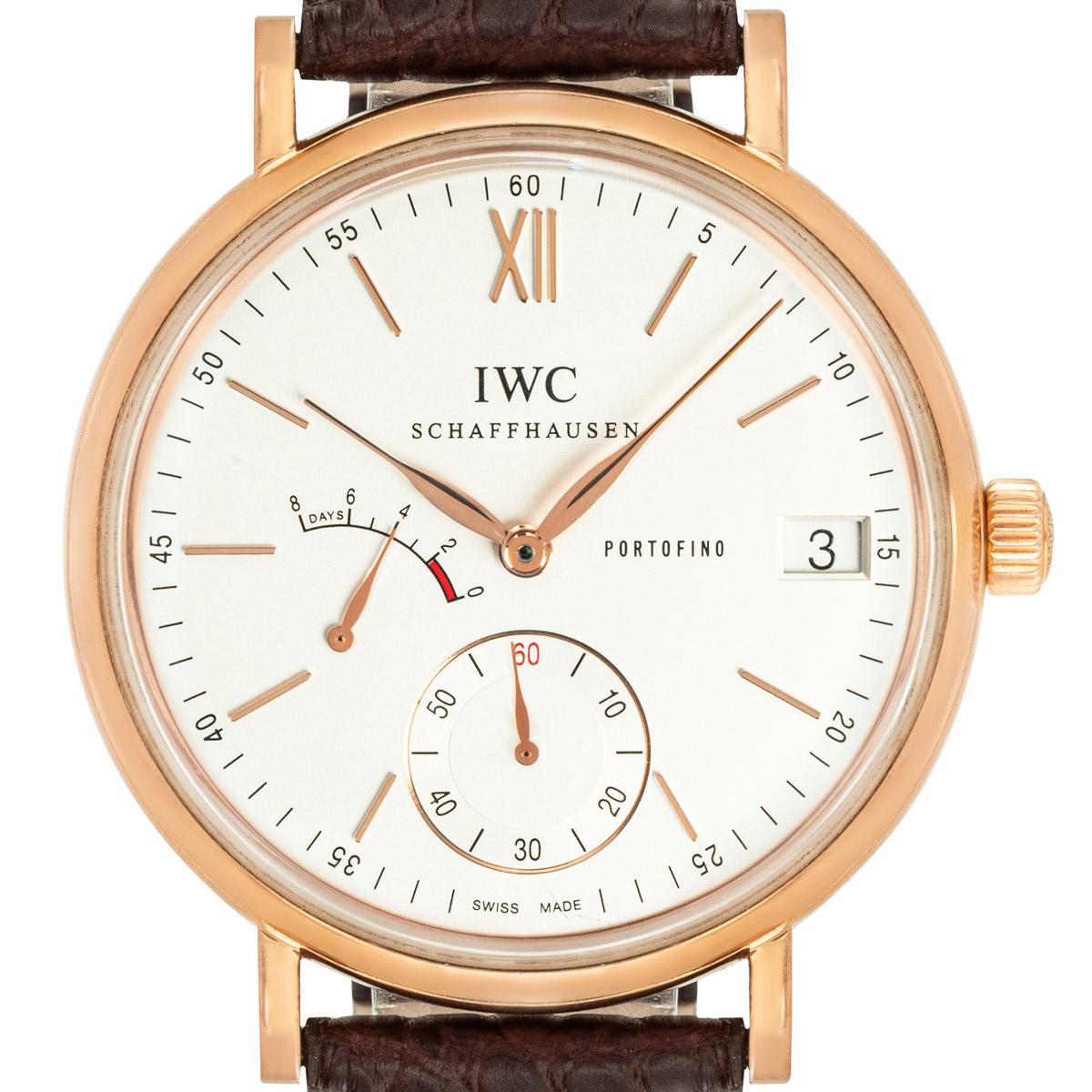 A rose gold 45mm Portofino wristwatch. Featuring a silver dial with applied hour markers, a date aperture, an 8-day power reserve indicator and a small seconds subdial.

The watch is presented on a generic brown leather strap and an IWC yellow gold