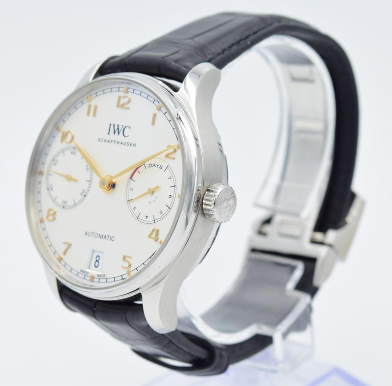 This IWC Portugieser IW500704 was recently traded in to our store and is in excellent condition. This watch will come with the original box, papers, and an additional XL strap. This watch is in a 42.3mm stainless steel case on a black crocodile