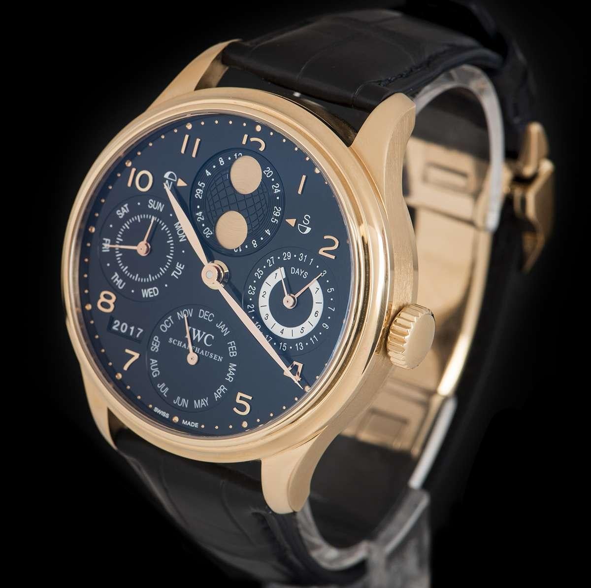 An 18k Rose Gold Portugieser Perpetual Calendar Gents Wristwatch, black dial with applied arabic numbers, date sub-dial and 7 day power reserve indicator at 3 0'clock, month sub-dial at 6 0'clock, year aperture between 7 and 8 0'clock, small seconds