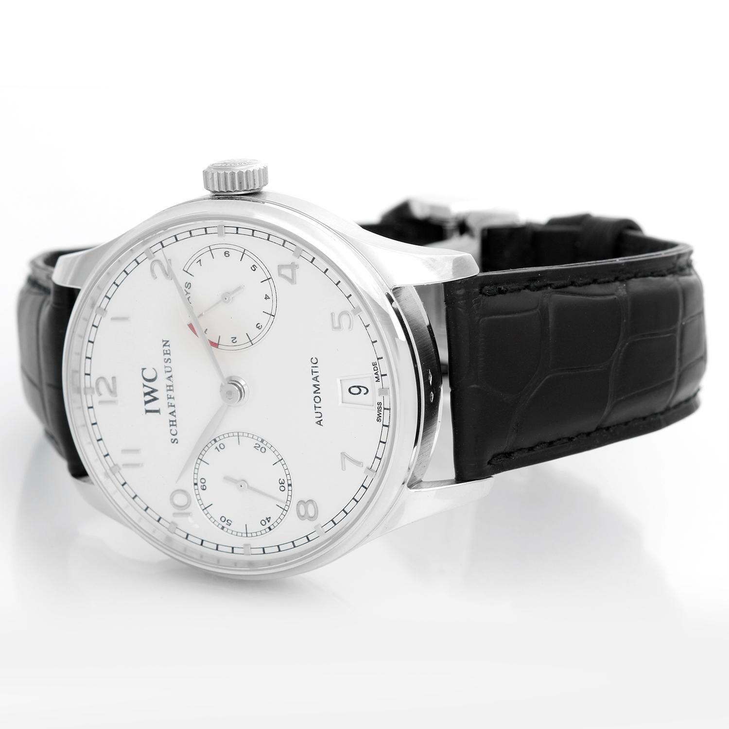 IWC Portugieser Platinum  Men's Watch IW500104 - Automatic winding. Platinum case with brushed finished edges ( 42 mm ). Silver dial with silver sub-dials with  Arabic numerals & Index hours. Black alligator strap with deployant buckle. Pre-owned