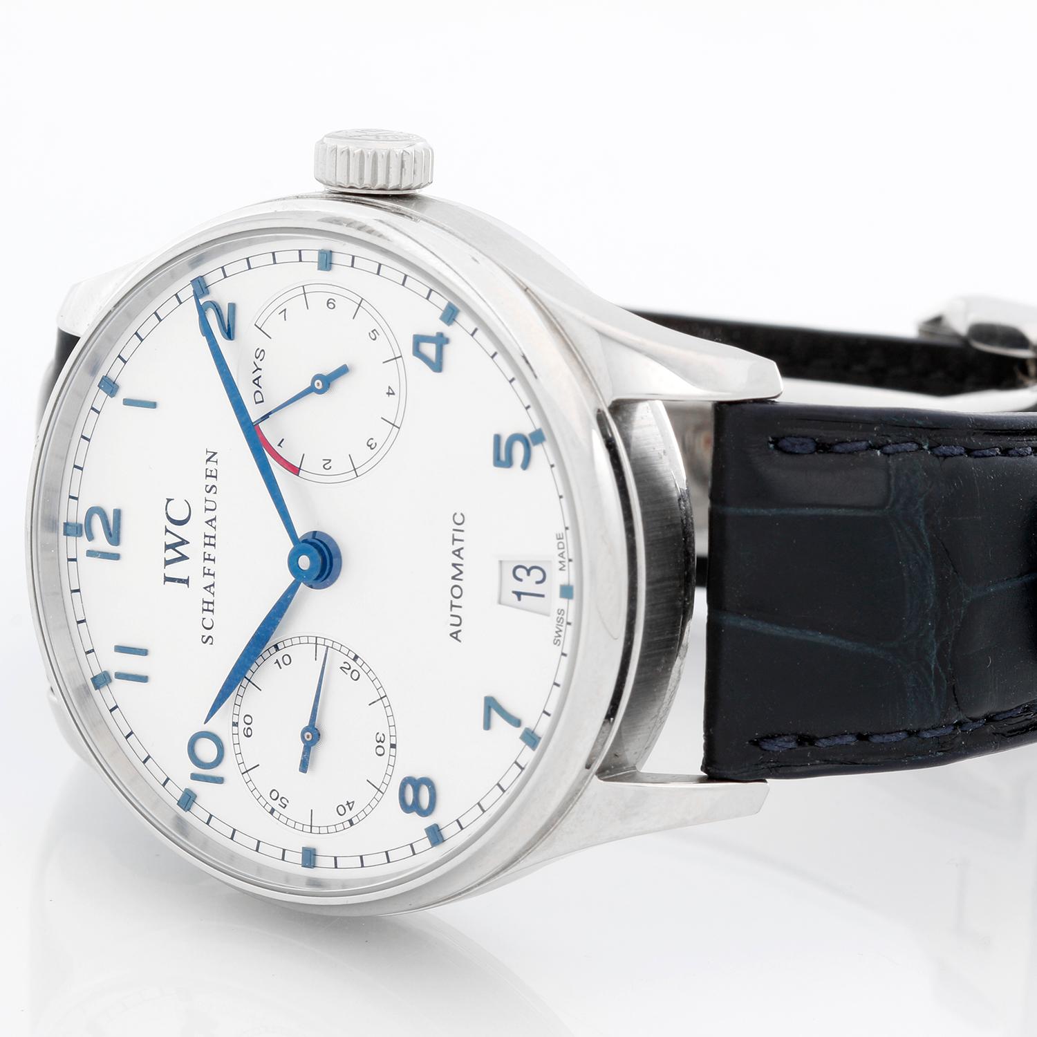 IWC Portugieser Stainless Steel Men's Watch IW500705 - Automatic winding. Stainless steel case with brushed finished edges ( 42 mm ) . Silver dial with silver sub-dials with blued steel Arabic numerals & Index hours . Black alligator strap with