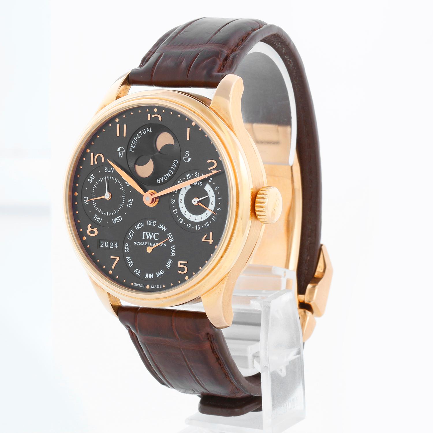 IWC Portuguese 7 Days Perpetual Calendar 18k Rose Gold Men's Complicated Watch IW503202 - Automatic winding; 62 jewels, 7 day power reserve. 18k rose gold case with exhibition back  (44mm diameter). Black dial with rose gold Arabic numerals; day