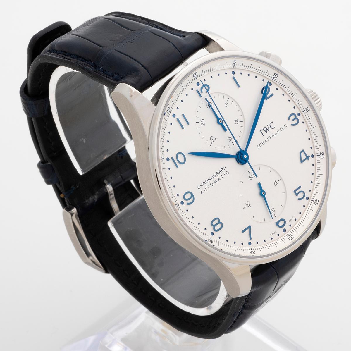 Our iconic IWC Portuguese Chronograph features a stainless steel 41mm case, with white dial and blue hands. This example is presented in outstanding condition and benefits from a full service at WIC in August 2022, the remainder of the 24 month