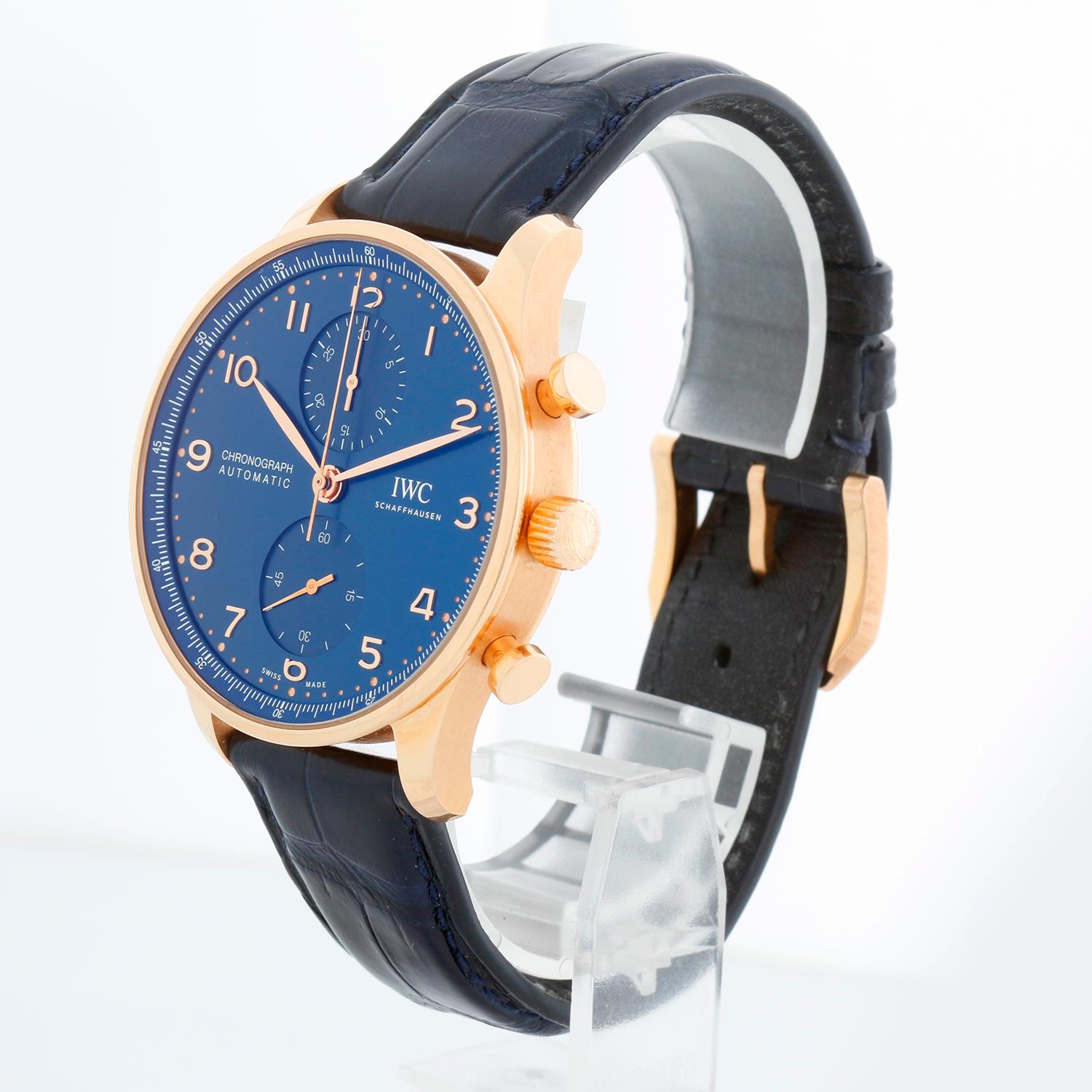 IWC Portuguese Chronograph Boutique Edition 41 Mm Portugieser Men's Rose Gold Watch IW371614 - Automatic winding, Chronograph. Portugieser. 18k rose gold case (41mm) with exposition back. Blue dial with rose Arabic numerals. IWC Blue strap with 18K
