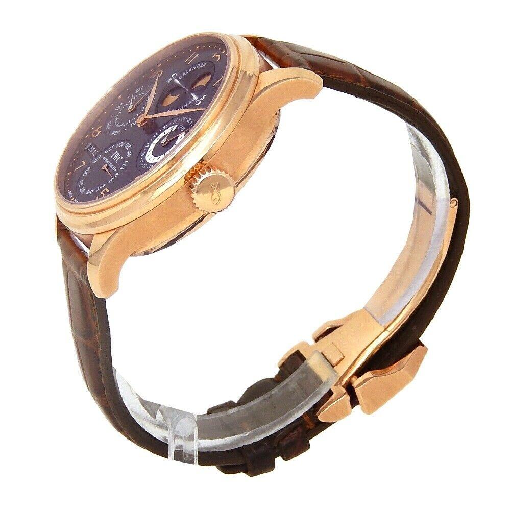 Brand: IWC
Band Color: Brown
Gender:	Men's
Case Size: 44-47.5mm	
MPN: Does Not Apply
Lug Width: 22mm	
Features:	12-Hour Dial, Chronograph, Gold Bezel, Sapphire Crystal, Swiss Made, Swiss Movement
Style: Casual	
Movement: Mechanical (Automatic)
Age