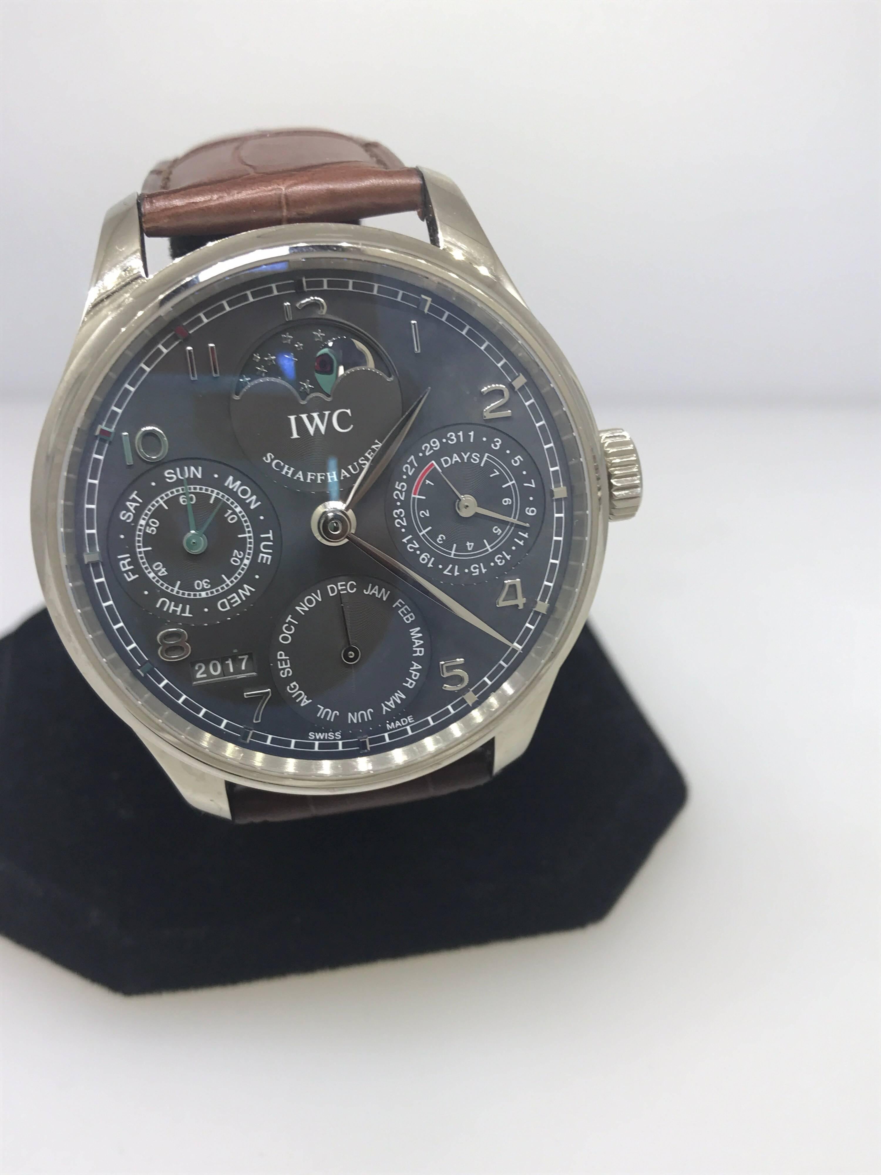 IWC Schaffhausen Portuguese Perpetual Calendar Men's Watch

Model Number: IW302507

100% Authentic 

New

Comes with original IWC Schaffhausen box, warranty card, and instruction manual

18 Karat White Gold Case & Buckle

See-through Case Back

Gray