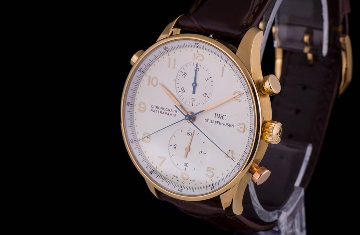An 18k Rose Gold Portuguese Chronograph Rattrapante Gents Wristwatch IW371203, silvered dial with applied 18k rose gold hands and arabic numbers, an original black leather strap (not as pictured) with an original 18k rose gold pin buckle, sapphire