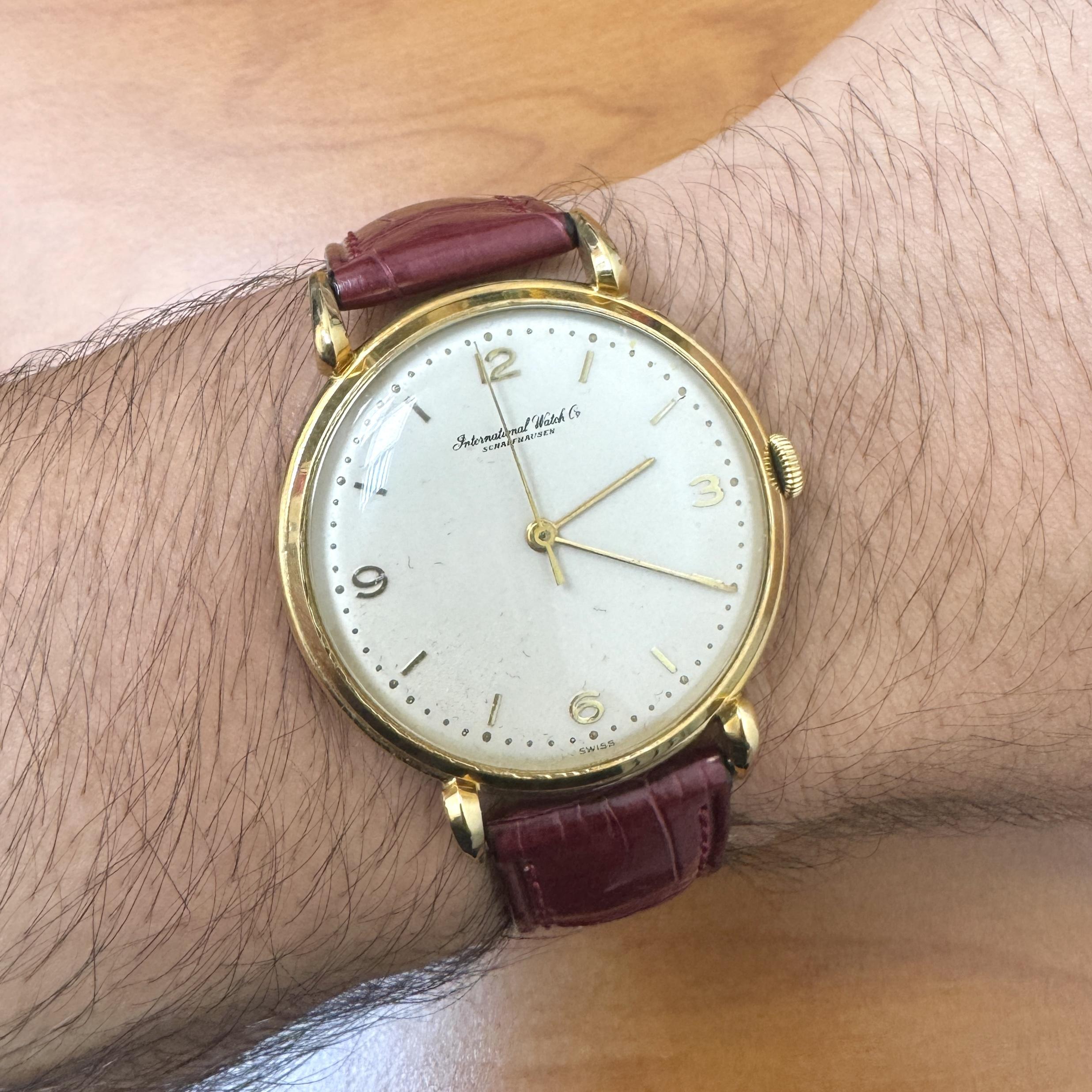 1940s manual wind IWC Schaffhausen wristwatch featuring a clean 36mm dial and elegant 18K yellow gold casing. A timeless vintage piece with mechanical charm and refined detailing.

Details:
Item Type: Wristwatch
Brand: IWC (International Watch