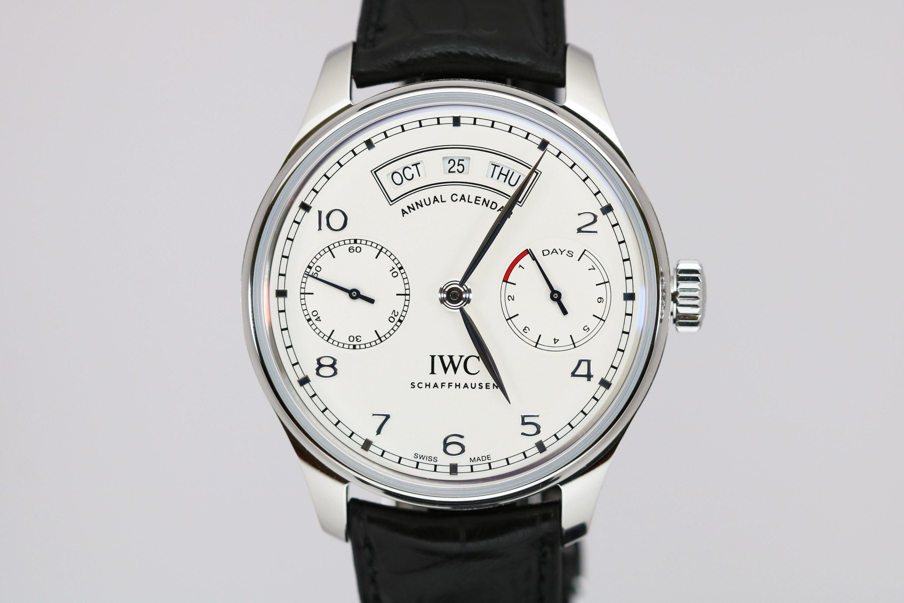 IWC Portugieser Annual Calendar Ref IW503501. The oversized 44mm case has an exhibition back showing the automatic movement that features an Annual Calendar, Power Reserve, and Subsidiary Seconds, Comes on an alligator strap with a deployant clasp.