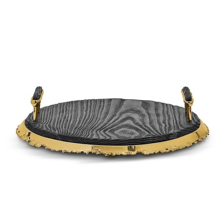 The Ikzi Tray is a harmonious fusion of artisanal tradition and timeless elegance, meticulously crafted to infuse warmth and refinement into any space. Its round pinewood surface is skillfully handcrafted using the Yakisugi technique, an ancient