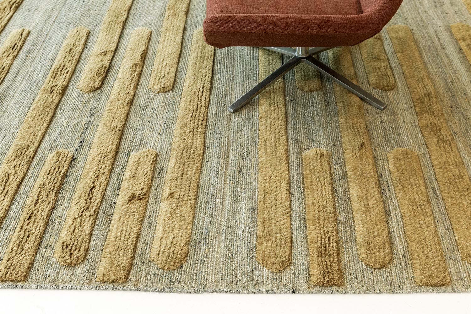 In Izu, flatweave and pile are joined in a tactile and syncopated composition of horizontal green-gold shapes on mossy gray flatweave. Izu is a rug for the senses. Refined design is matched with vivid tonal palettes in the Michael Berman Collection.