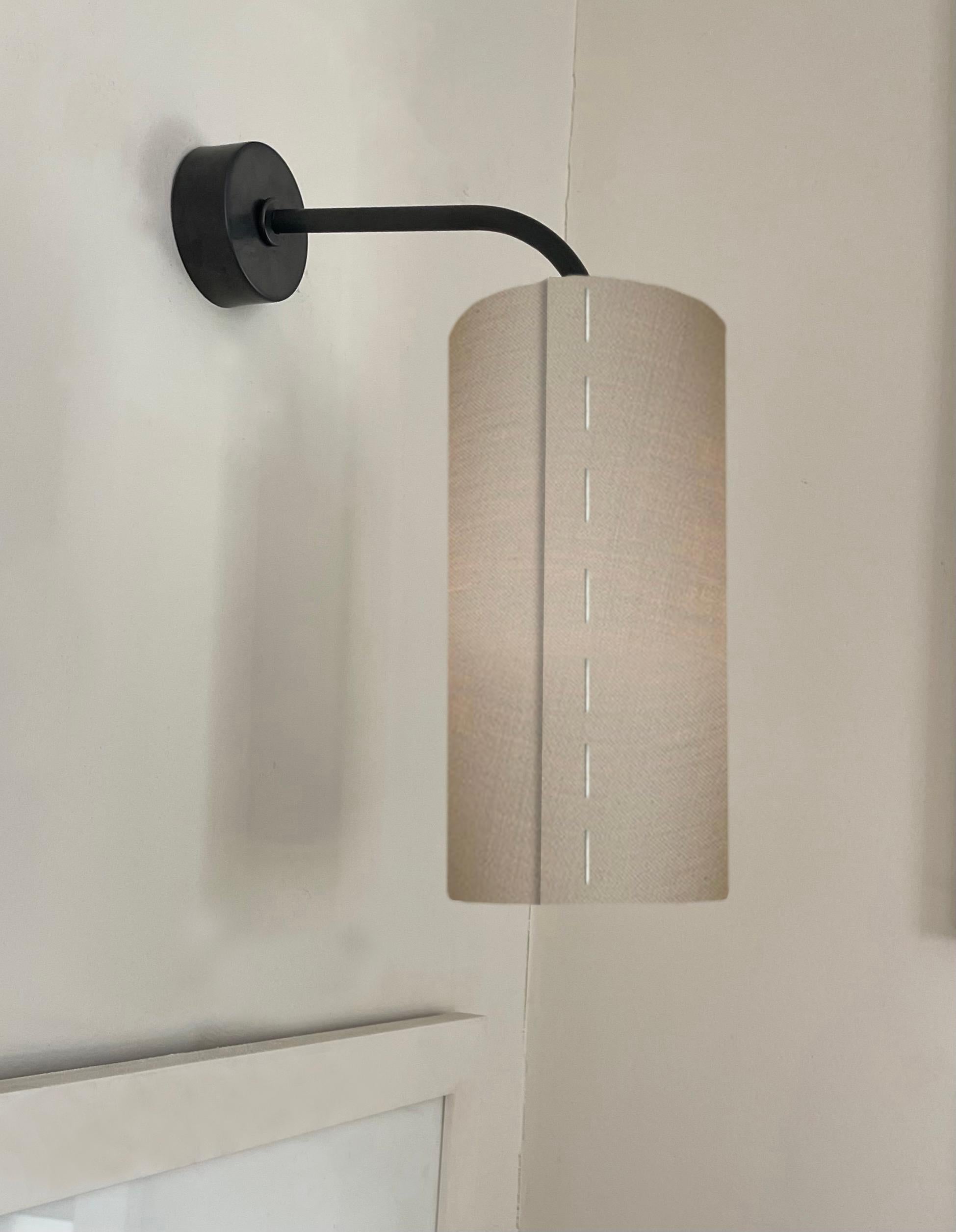 J 160 Inverso Wall and picture light is a timelessly simple, rustic modern light to be used individually in pairs or multiples. We our patinated solid brass fixtures are made to order with a light, medium or dark finish.  We also plate fixtures for