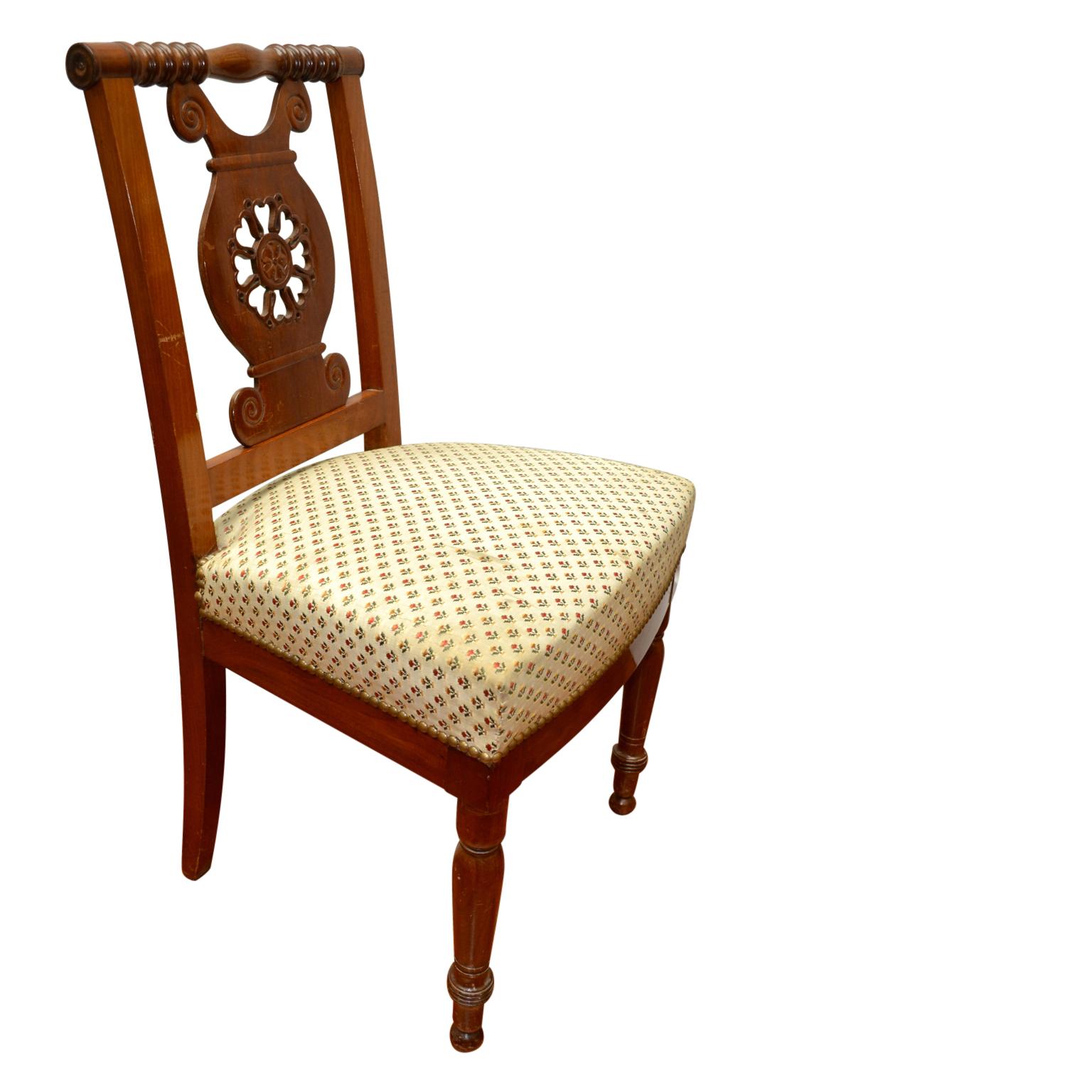 A set of six period Directoire dining chairs carved in Honduras mahogany. Identical chairs are shown in the reference book 