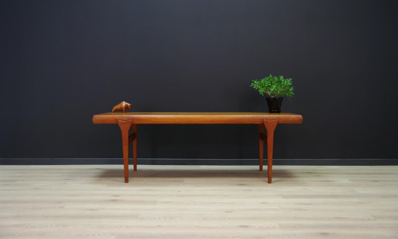Extraordinary table from the 1960s-1970s, Scandinavian design made by J.Andersen. Table top veneered with teak. Two pull-out inserts - a drawer and an additional top. Preserved in good condition (small bruises and scratches) - directly for