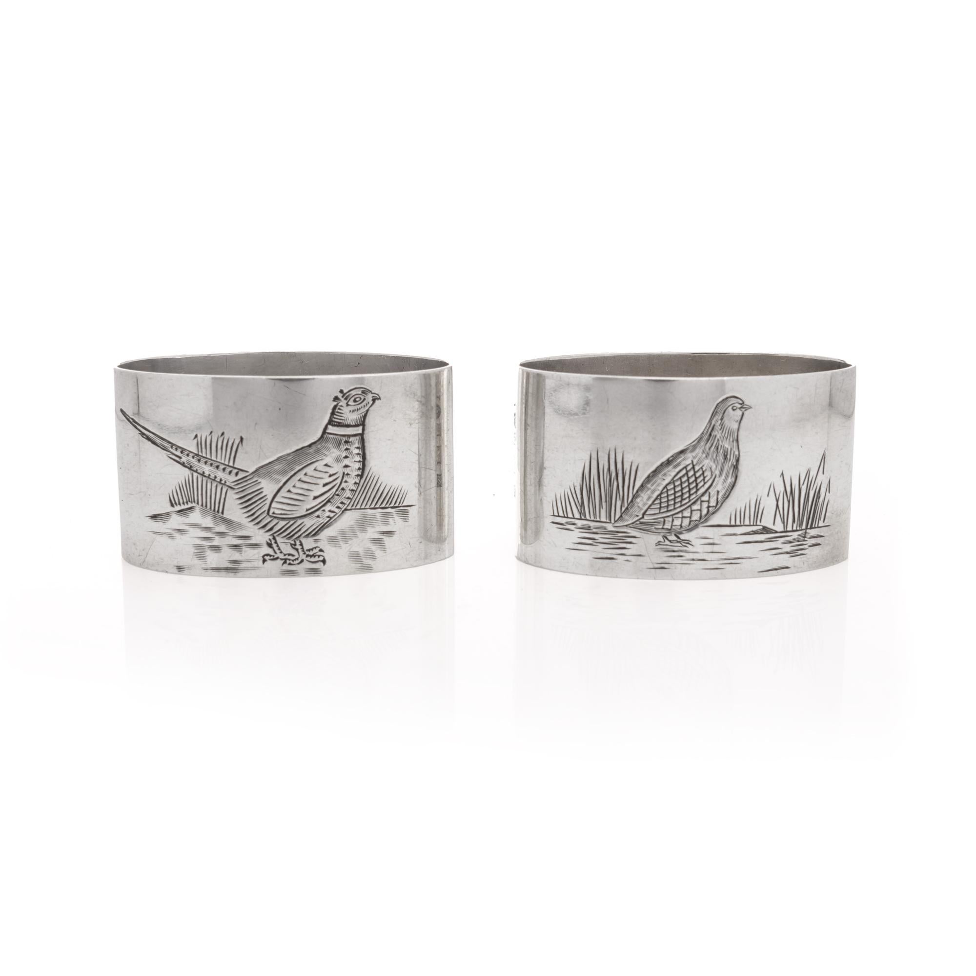 Introducing a timeless treasure: a pair of 925 sterling silver napkin rings nestled within an elegant case. Crafted in a captivating ellipse shape, each ring showcases the graceful presence of pheasant birds—one male, one female—adding a touch of