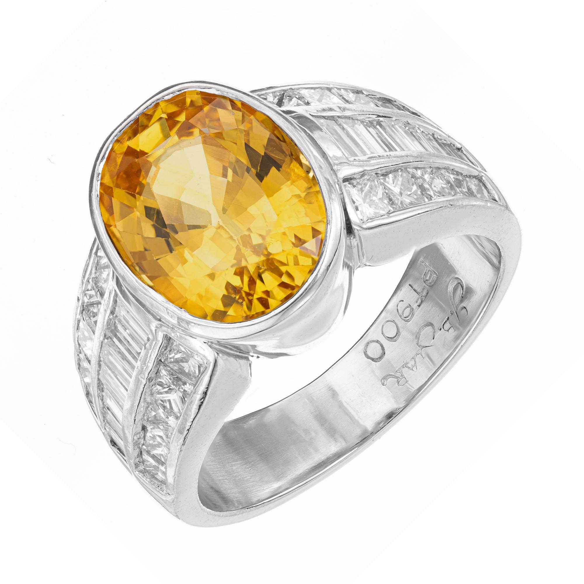 J.B. Star yellow sapphire and diamond engagement ring. GIA certified oval center stone in a platinum setting with baguette and princess cut accent diamonds. 

1 Bright yellow natural corundum Sapphire, approx. total weight 5.29cts, 11.70 x 8.61 x