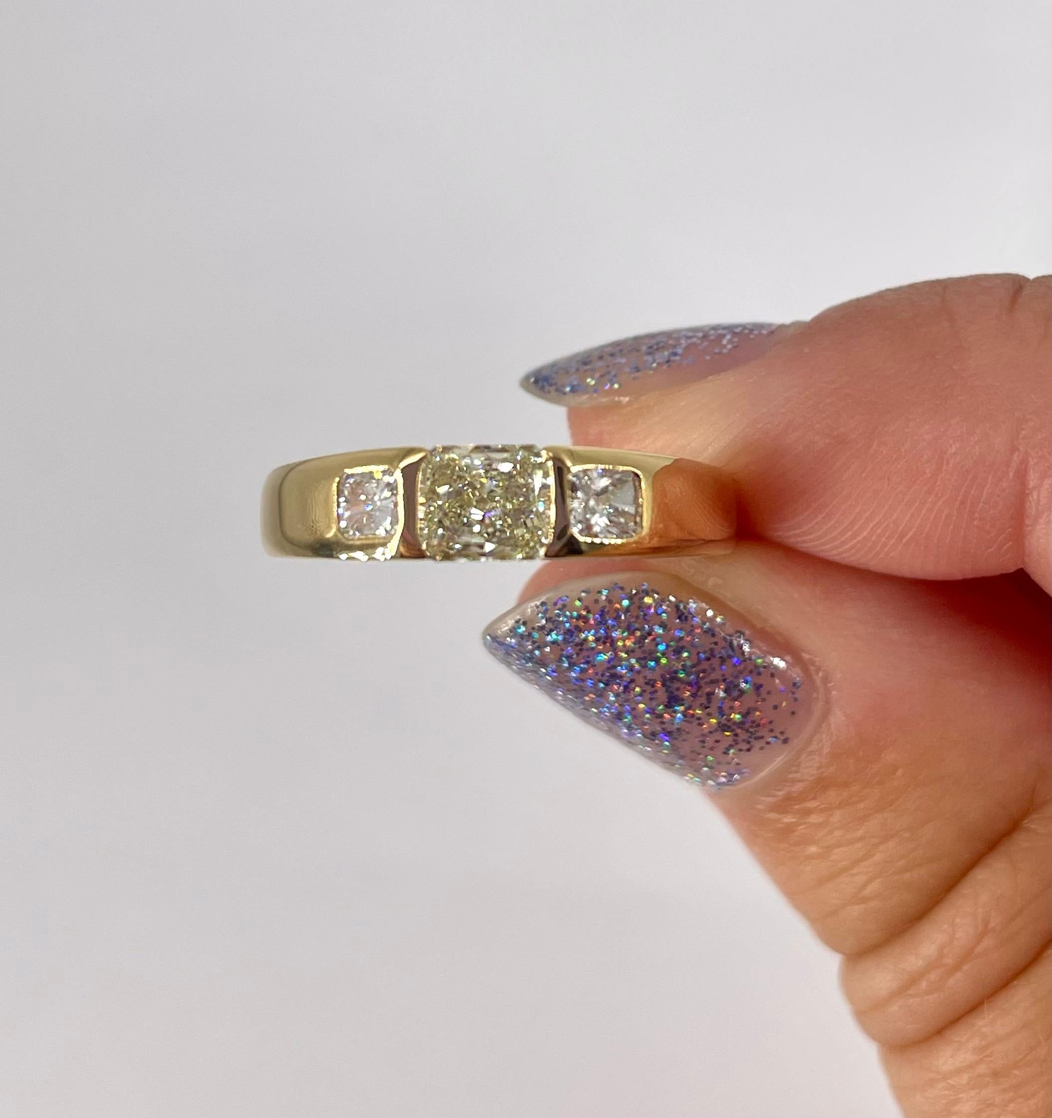 Radiant Cut J. Birnbach 0.55 carat Fancy Light Yellow Radiant Diamond Three Stone Ring For Sale