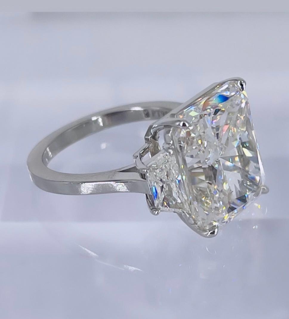 This exceptional diamond ring is a masterpiece by J. Birnbach. The ring showcases a GIA certified 10.03 carat radiant cut with J color and SI2 clarity. The diamond does not show any warmth and there are no visible inclusions. The radiant is