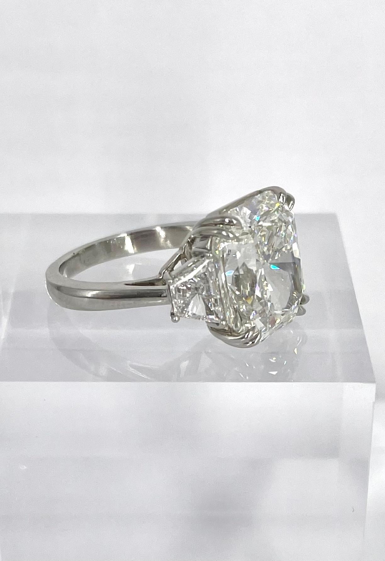 This gorgeous radiant cut engagement ring is a timeless piece that exudes elegance and glamour. Featuring a 10.05 carat radiant certified by GIA to be G color and VS1 clarity, this diamond is exceptionally sparkly and brilliant. The center diamond