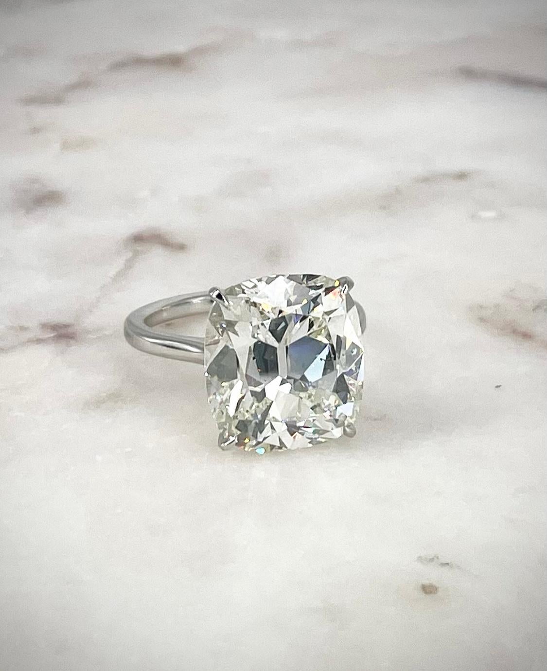 This magnificent cushion solitaire is a showstopper! The diamond is 10.38 carats and certified by GIA to be J color and SI2 clarity. This is an antique style cushion, cut with a beautiful pattern of large facets that give an Old World feel and