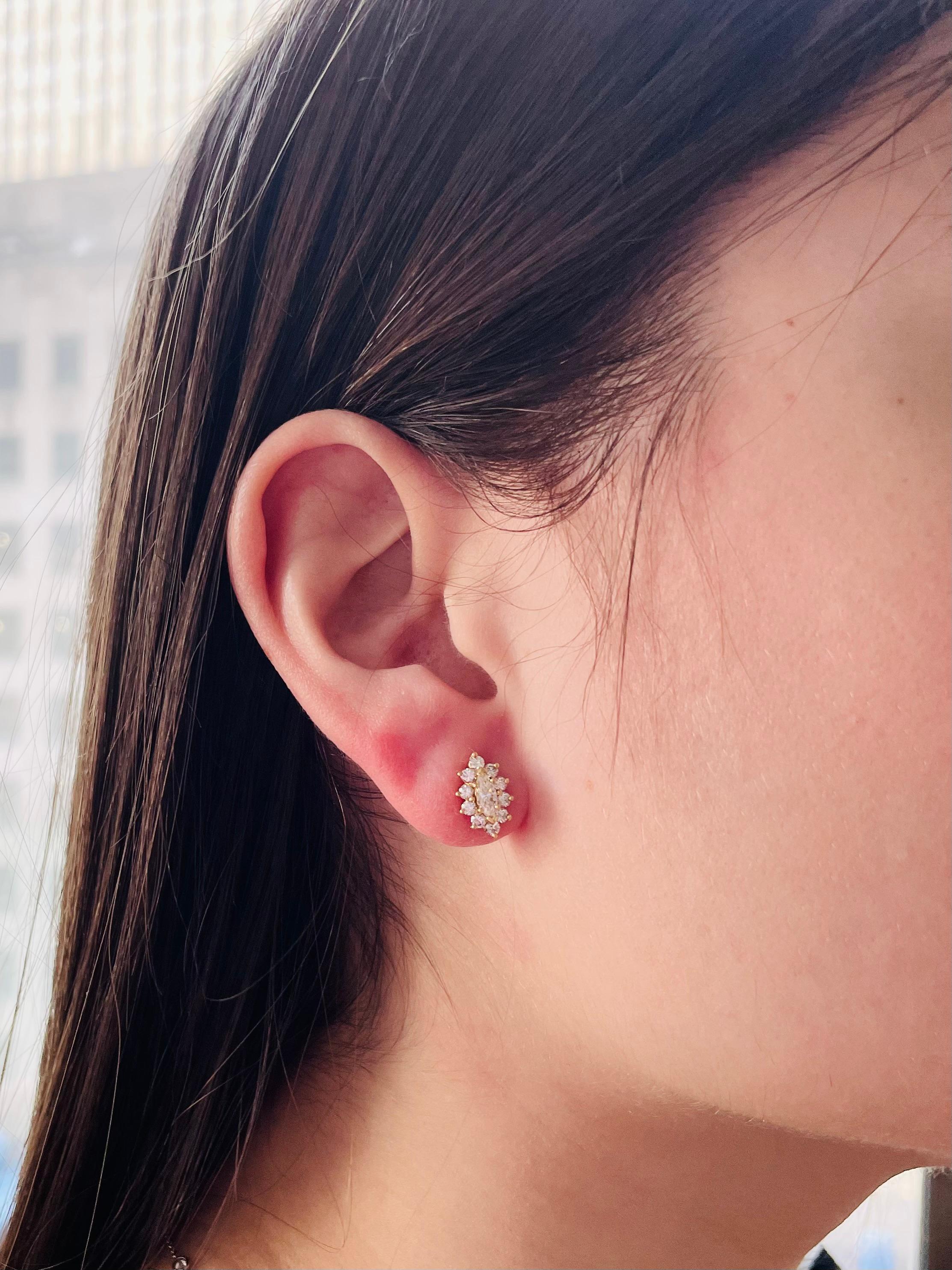 These sparkling studs are a statement on their own or a great addition to your ear stack! Crafted in 18K yellow gold, these earrings feature two marquise shape diamonds (total 0.41 carats) surrounded by a halo of round diamonds (total 0.68 carats).