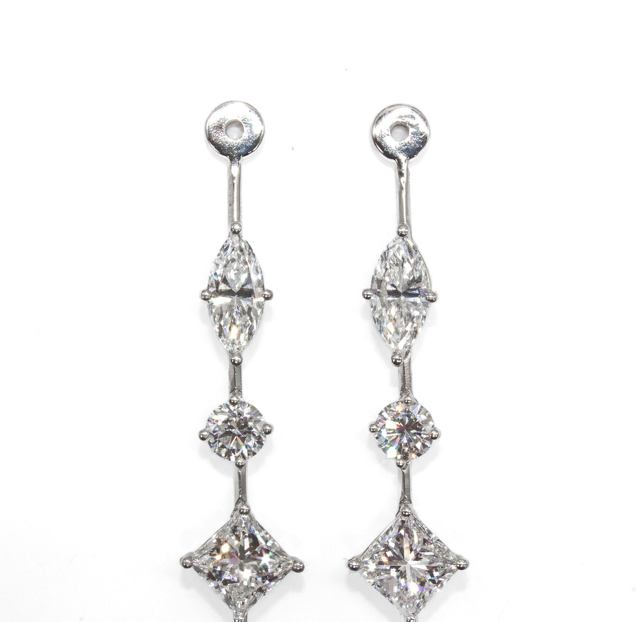 These versatile platinum earring jackets from J. Birnbach offer a sophisticated way to transform your favorite diamond studs into a dramatic, show-stopping look. Designed as removable drops, they feature a dazzling array of mixed diamond