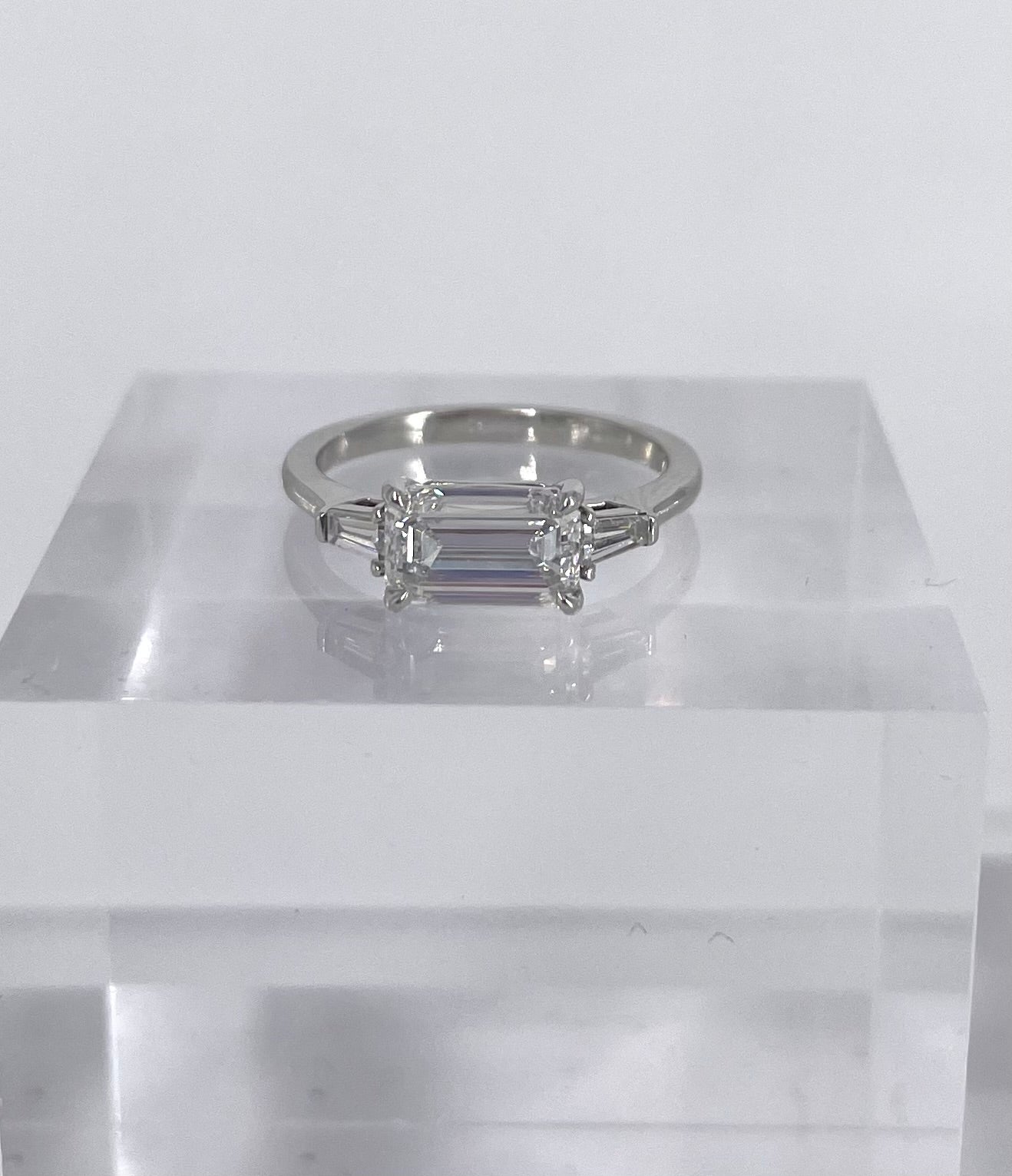 This unique and sophisticated ring from the J. Birnbach workshop is perfect for someone looking for a fresh take on a timeless style! This very elongated and narrow 1.51 carat emerald cut is perfect for an east-west setting. The diamond has been