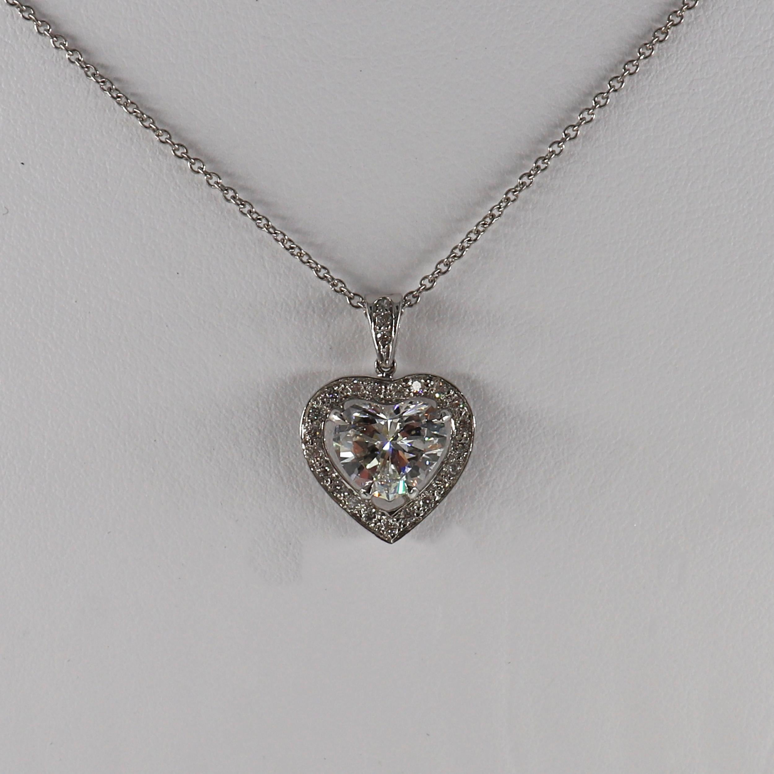 This J. Birnbach Heart-Shaped Diamond surrounded by a pave halo necklace will be the perfect gift for your sweetheart! This necklace is crafted in 18 karat White Gold and features a GIA Certified Heart-Shaped 1.52 carat diamond with a G color and