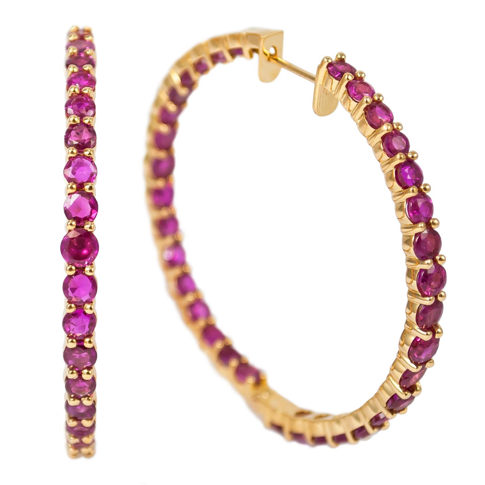 Passionate rubies are set along the inside and outside edges of these 18K yellow gold, handmade hoop earrings. With an eye to detailing, these J. Birnbach originals are the perfect way to jazz up any look and make an equally charming gift for that
