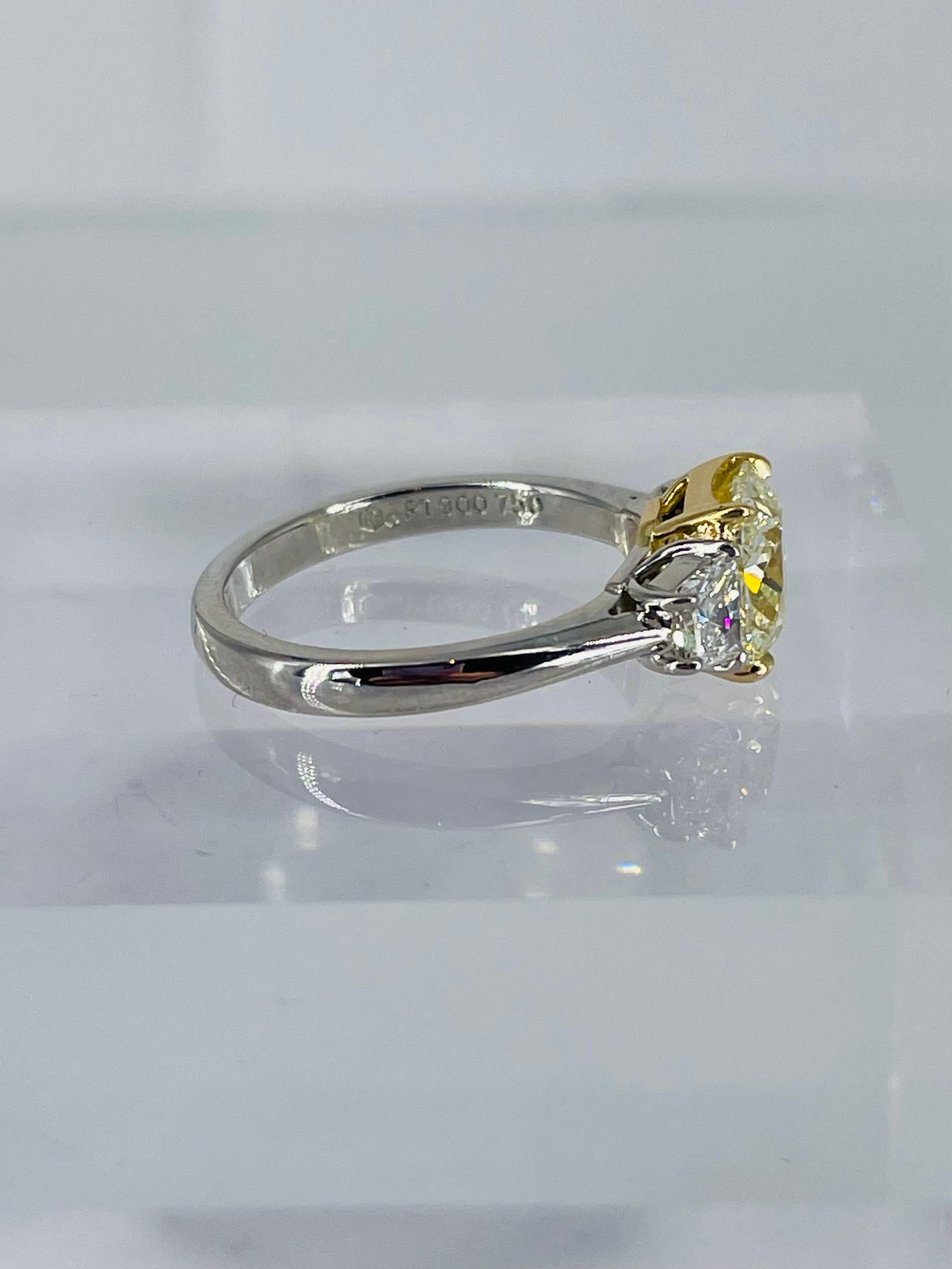 This sweet ring is the perfect combination of sparkle and color! A truly special find, this 2.17 carat cushion is GIA certified as S-T color and VS1 clarity. Set in 18K yellow gold, the diamond has the vibrant color and saturation of a Fancy yellow