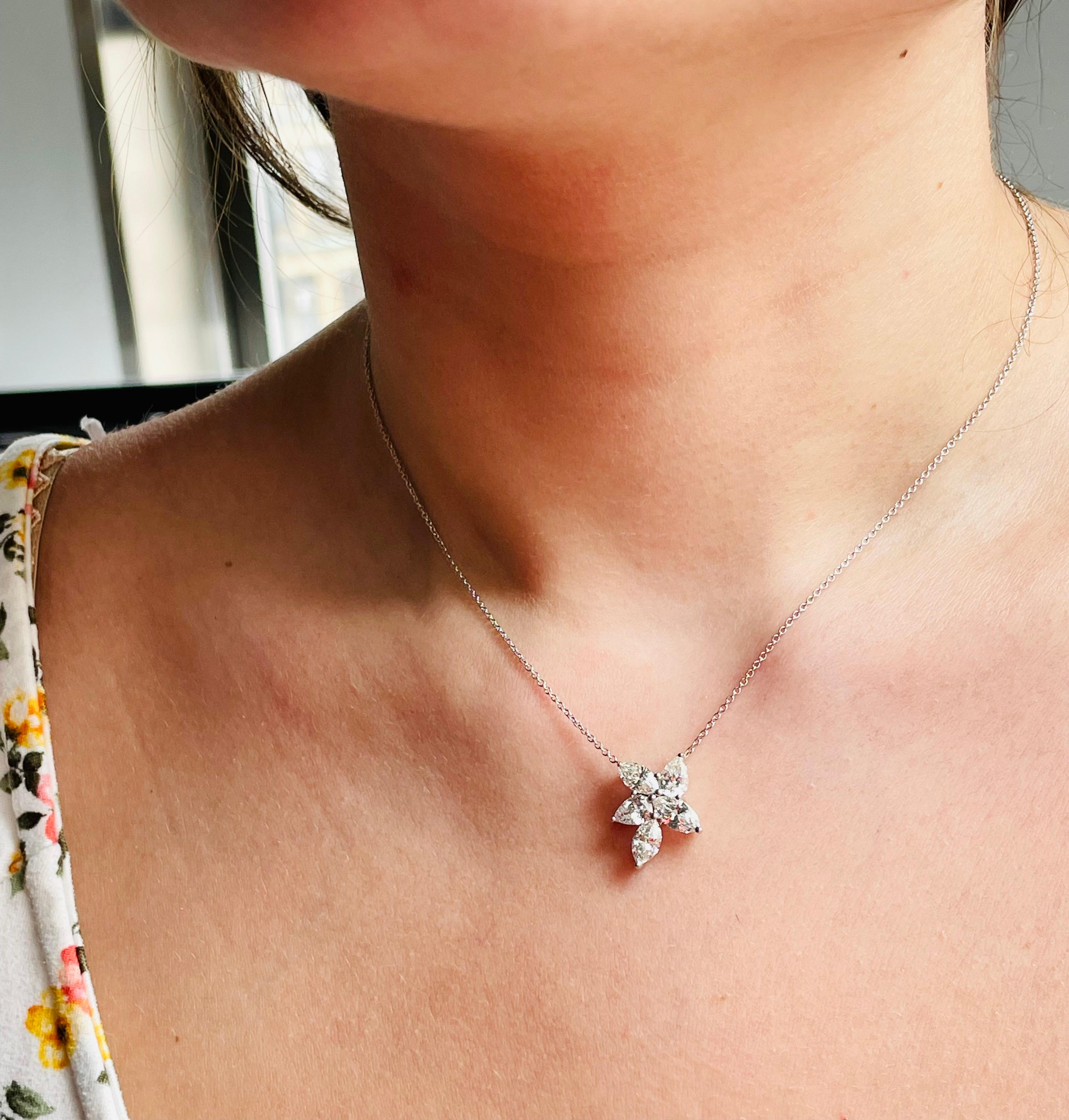 This glamorous diamond pendant by J. Birnbach is a fresh take on a classic style. The asymmetrical arrangement of pear and marquise shape diamonds creates interest and texture, perfect for someone who loves a unique design. This striking piece