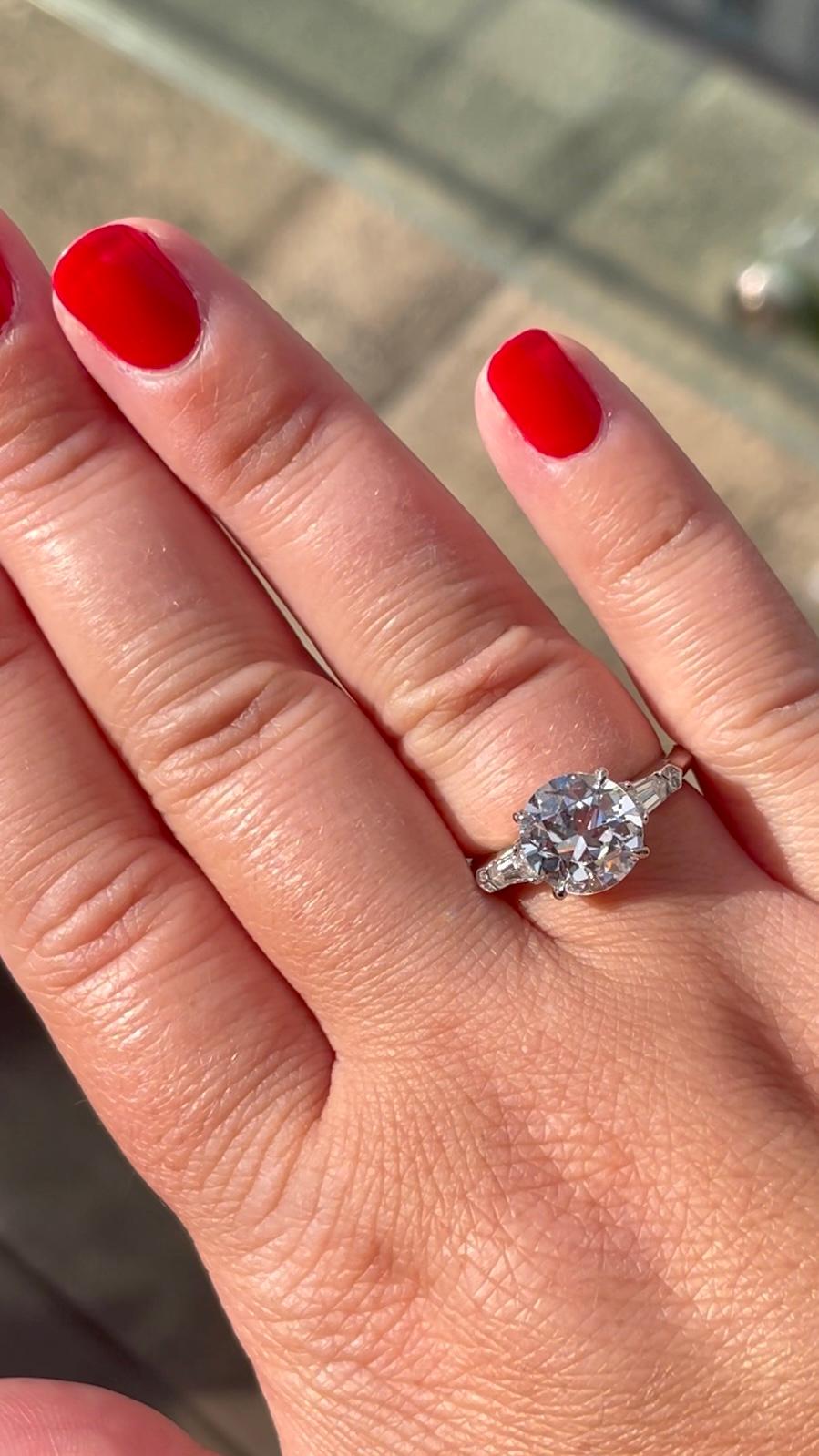 This stunning engagement ring is a timeless, classic piece. It features a spectacular 2.44 carat antique European cut diamond, certified by GIA to be G color and SI1 clarity. This is a higher color and clarity than is usually seen in an antique