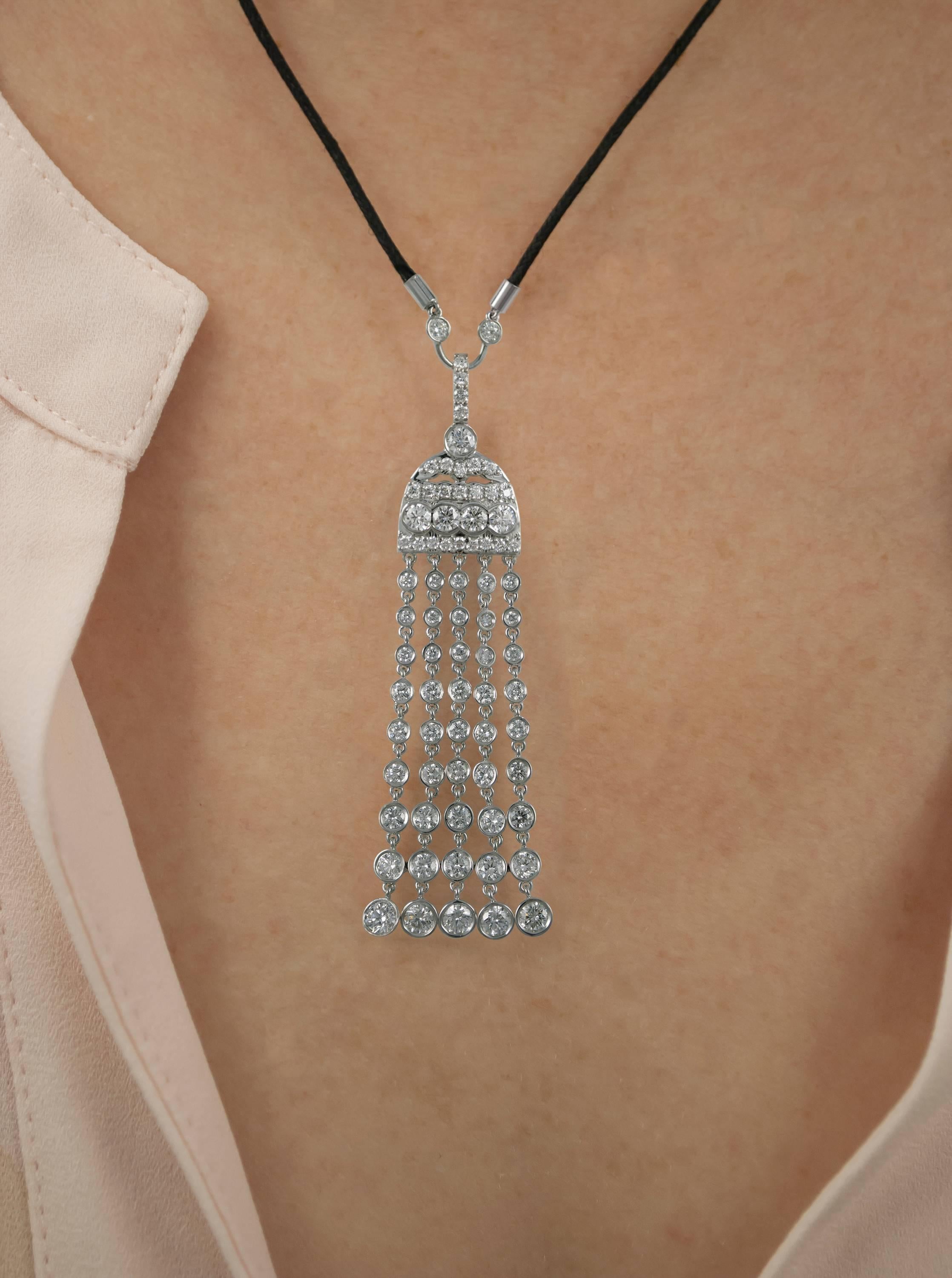 Breathtaking and truly one-of-a-kind, this 18K white gold tassel pendant is the essence of sophistication. This piece features 2.68 ctw of bezel-set, brilliant round diamonds. Jump ring connections allow for maximum movement between settings to