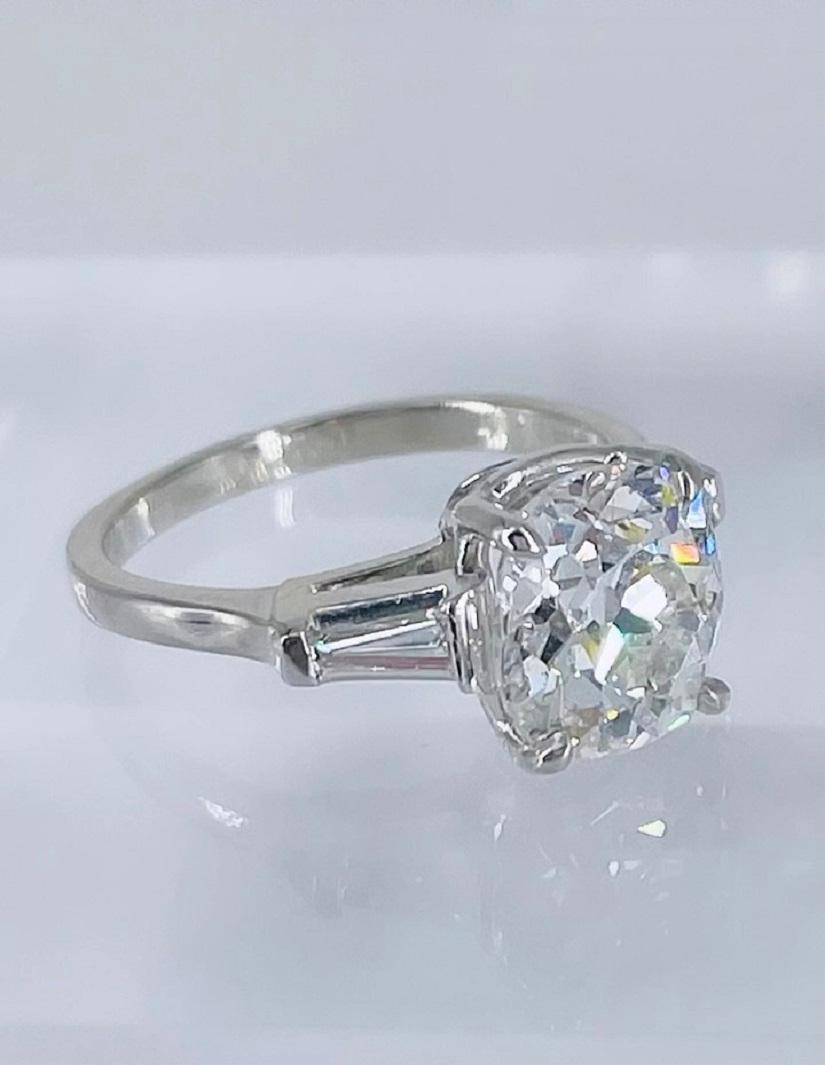 This classic engagement ring by J. Birnbach features an exceptional antique Old Mine cut diamond. It is 2.77 carats and certified by GIA as E color and SI2 clarity. The elongated cushion shape, large facets and visible culet are all special