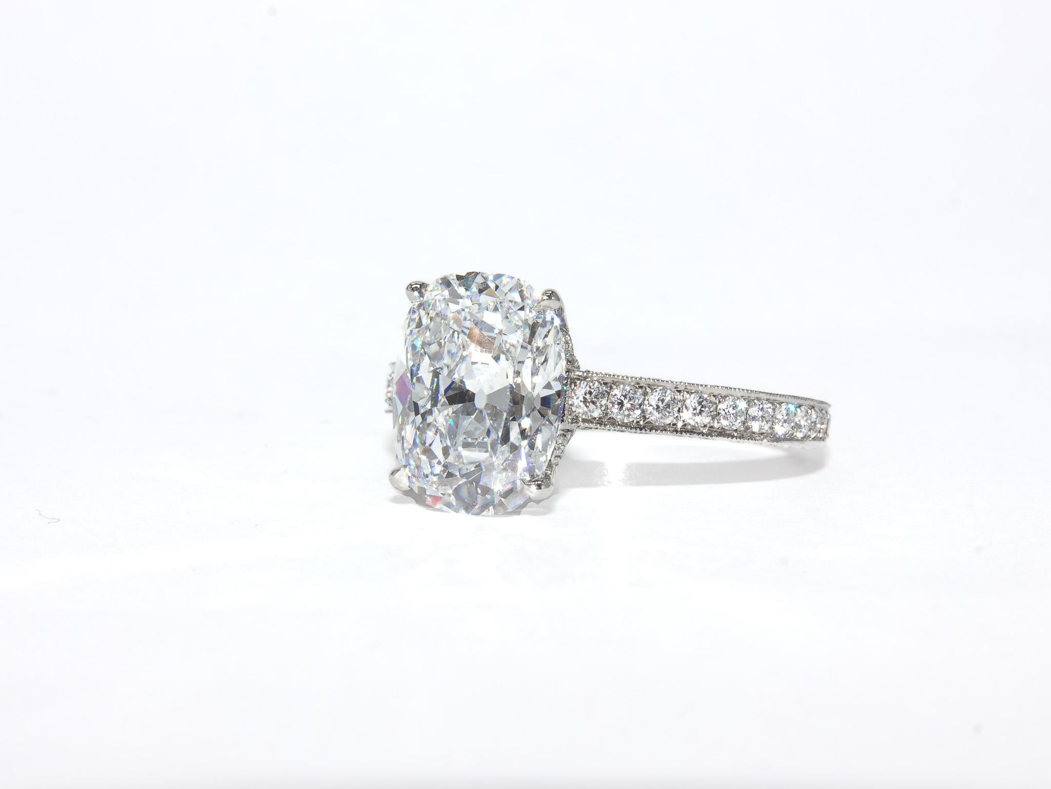 This breathtaking engagement ring by J. Birnbach showcases an exceptional 3.18 carat cushion brilliant diamond, GIA certified with D color and SI1 clarity. The diamond’s D color grade—the highest possible—makes it incredibly rare and highly sought