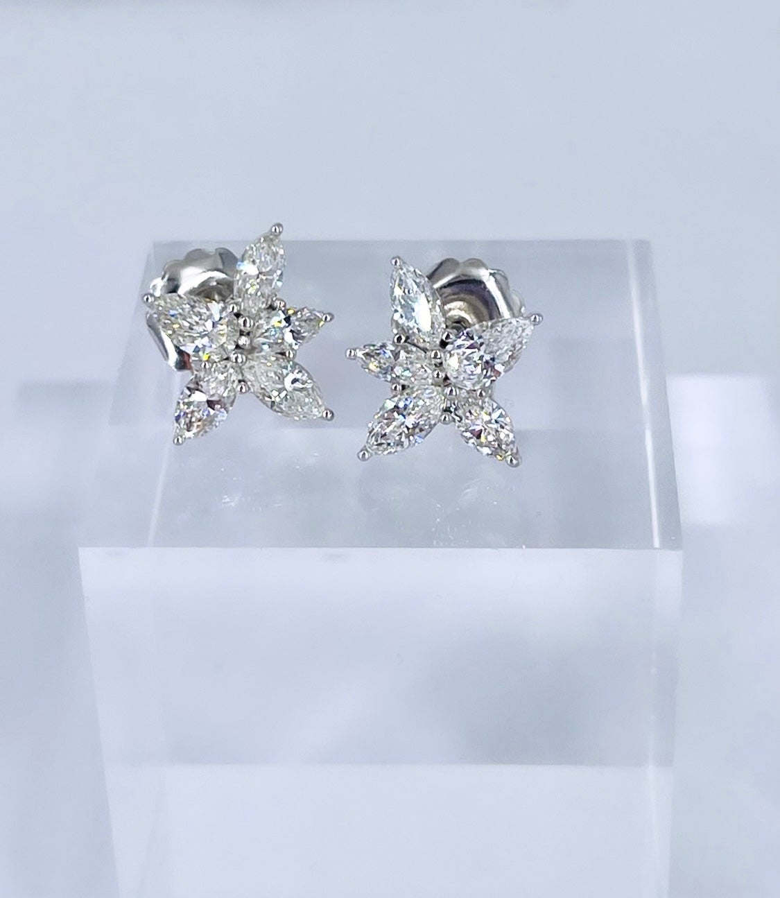 These glamorous earrings by J. Birnbach are a timeless style that adds elegance and sparkle to any ensemble. Perfect for a black tie affair or for a bride, pear shape and marquise diamonds create a lively starburst design. Crafted in 18K white gold,