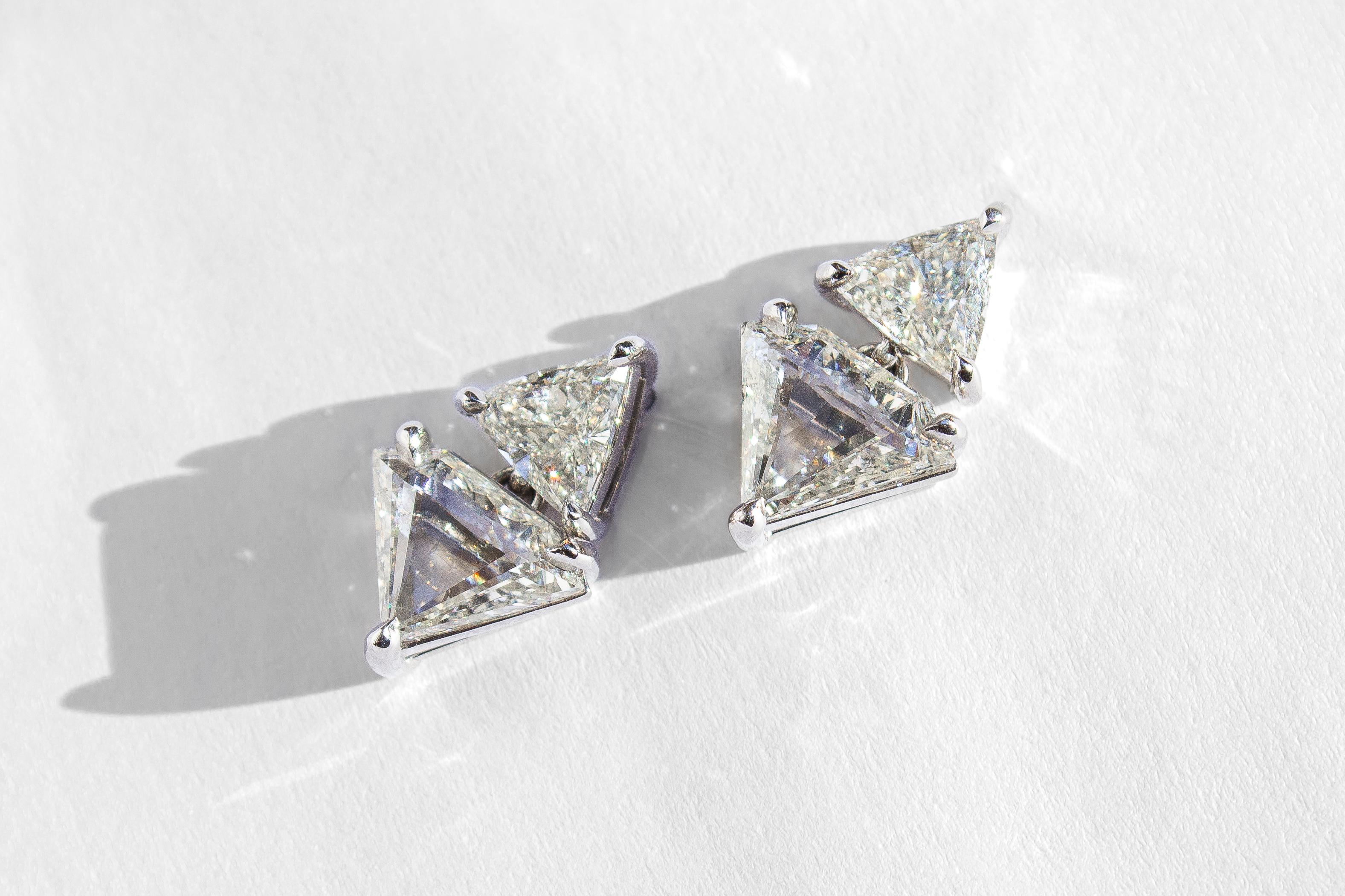 Elevate your style with this unique and versatile pair of diamond drop earrings, offering the perfect balance of edgy sophistication and timeless elegance. The design features sparkling trillion-cut diamonds set in the studs, totaling 1.27 carats.