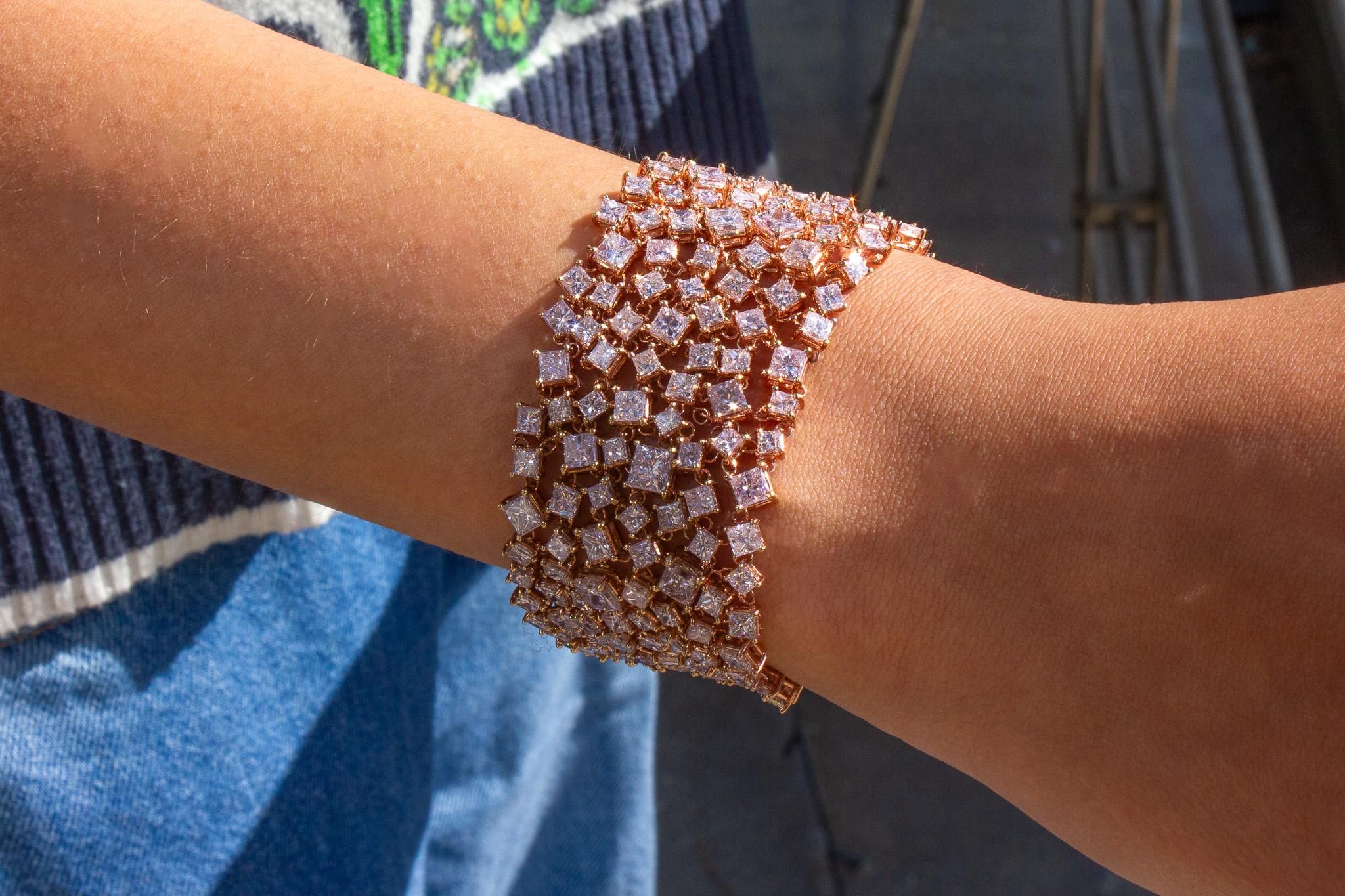 Add a touch of luxury to your collection with this extraordinary J. Birnbach 18K Rose Gold Mesh Bracelet, featuring a total of 39 carats of GIA certified Fancy Pink princess cut diamonds. This breathtaking piece showcases 224 assorted Fancy Pink