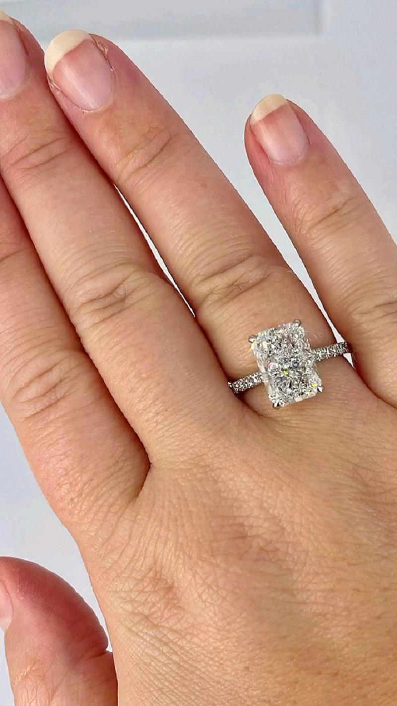 This spectacular pave solitaire by J. Birnbach is perfect for someone looking for sparkle! This engagement ring features a stunning 4.01 carat radiant cut diamond, certified by GIA as D color and SI1 clarity. D color is the highest color grade,