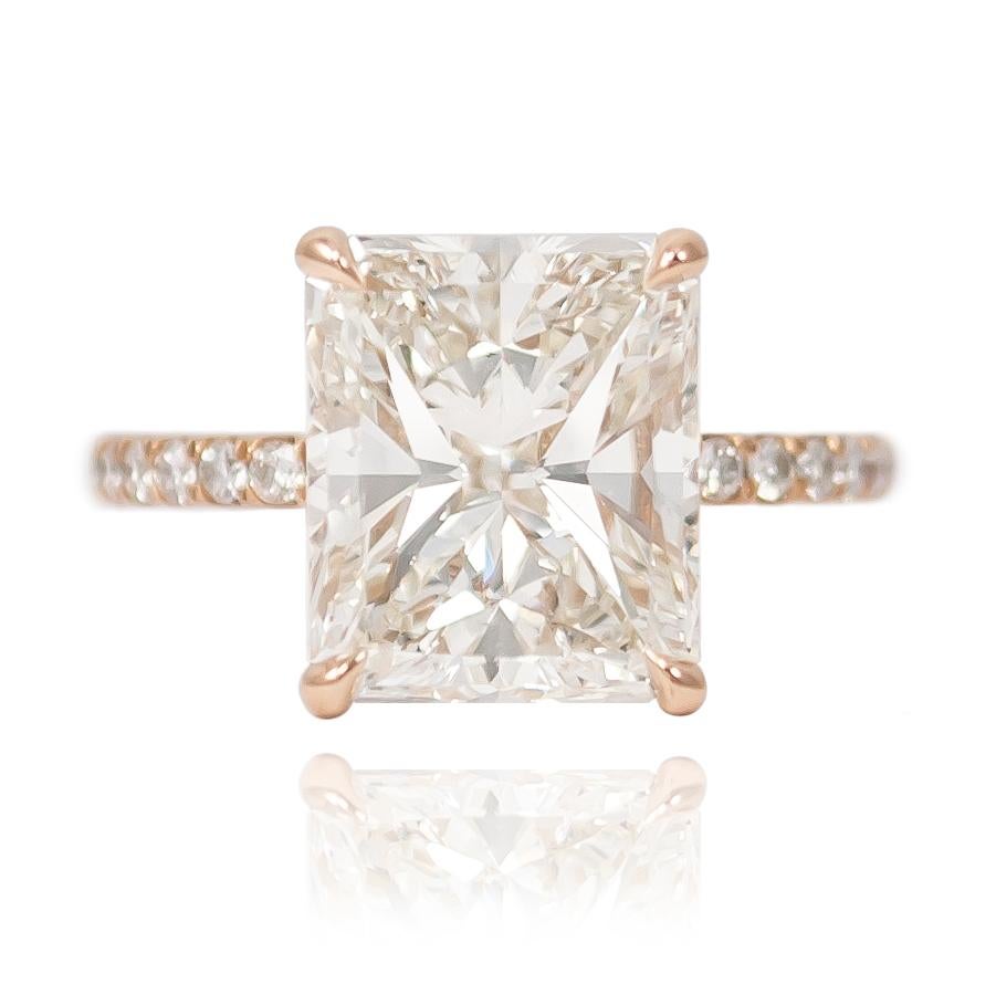 This breathtaking piece fresh from the J. Birnbach workshop features a EGLUSA certified 5.01 ct Radiant cut diamond of I color and VS2 clarity. The handmade 18K Rose Gold mounting is the essence of delicate and sophisticated with diamond pavé = 0.35