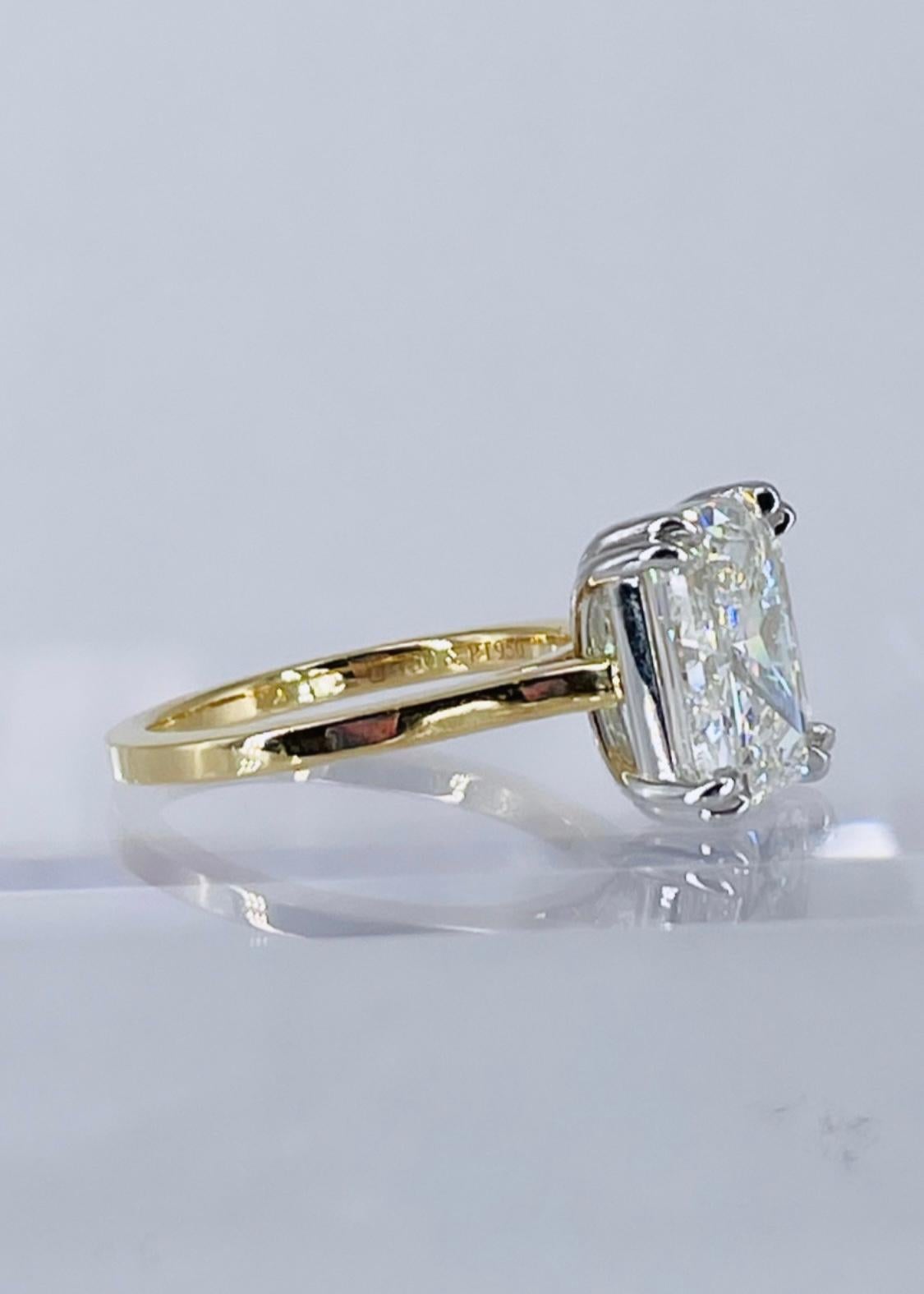 Sparkling and sophisticated, this elegant engagement ring by J. Birnbach is a beautiful execution of the modern solitaire. The ring showcases a 5.01 carat GIA certified radiant cut diamond, with K color and SI2 clarity. The diamond is set in a