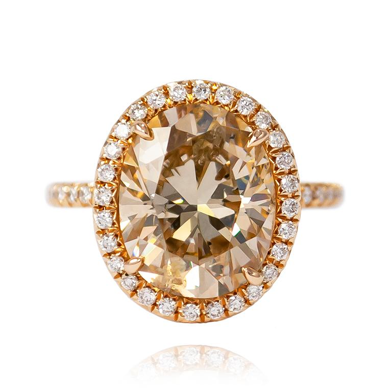 This beautiful and sophisticated ring from the J. Birnbach vault features a 5.04 ct Natural Champagne color Oval.  Set in a handmade 18K Rose Gold Ring with Brilliant Round pavé details = 0.35 ctw, this piece is the essence elegant. 

Purchase