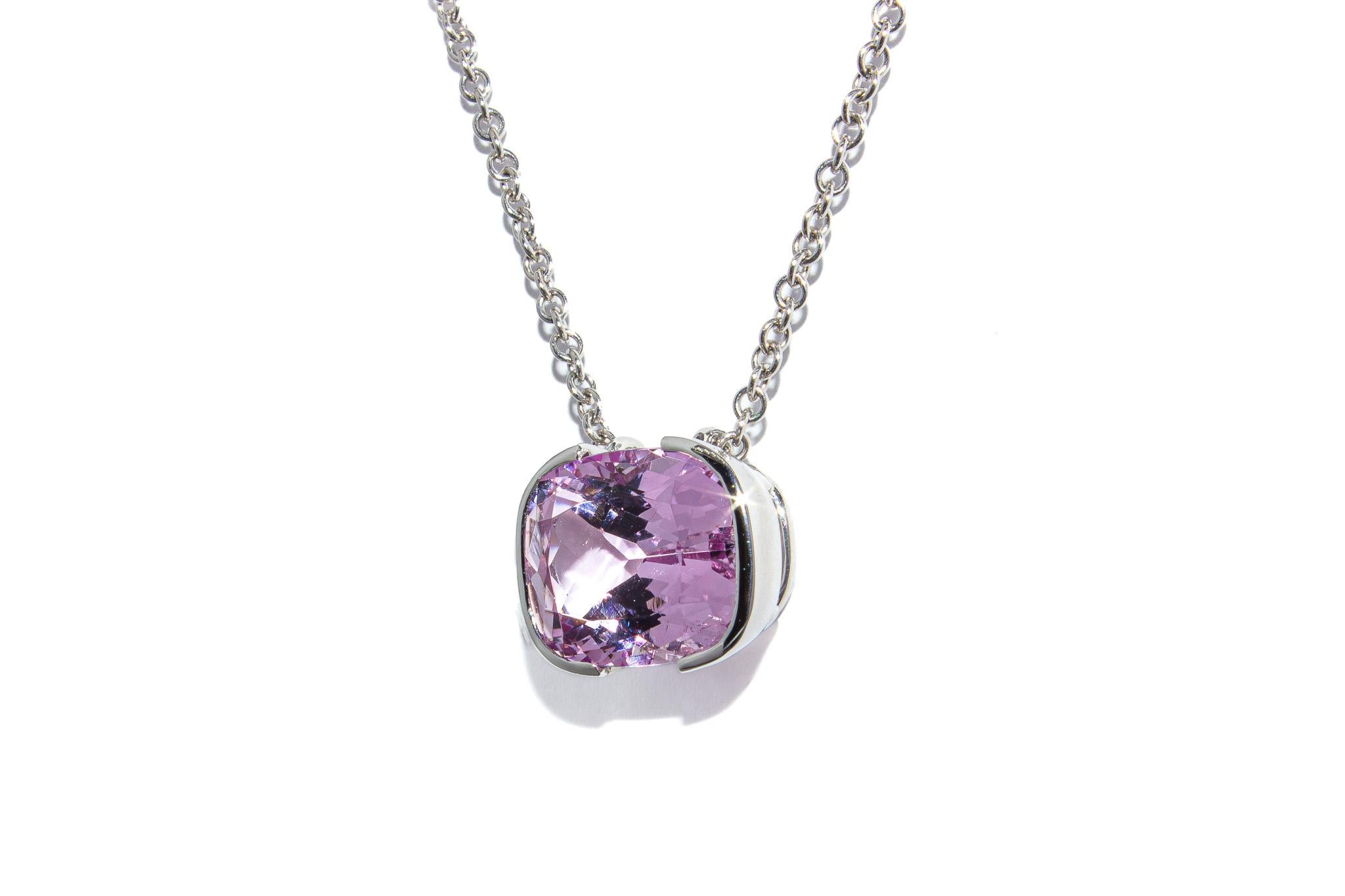 This elegant platinum pendant necklace features a vibrant 6.16 carat cushion cut pink topaz, celebrated for its lively hue and captivating brilliance. The stone’s rich pink color radiates beautifully against the cool, refined backdrop of platinum,