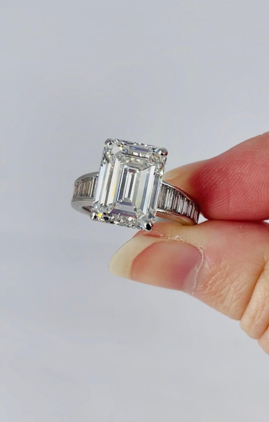 This one of a kind engagement ring is a unique statement piece by J. Birnbach. The ring features a 6.35 carat GIA certified emerald cut diamond,   I color and VVS2 clarity as described by report #5234160772. The diamond is a finger flattering