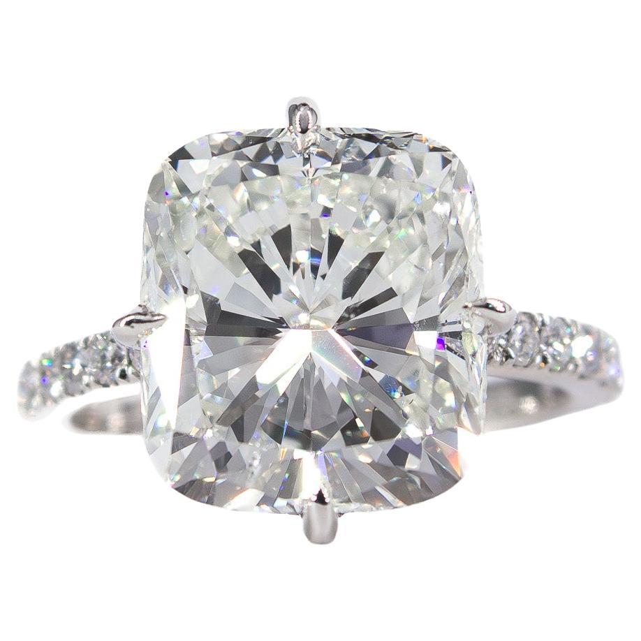 This brand new piece from the J. Birnbach workshop features a mesmerizing 7.22 carat cushion modified brilliant diamond certified by GIA to be J color and SI1 clarity. This beautifully elongated diamond is set in a handmade, platinum ring with pave