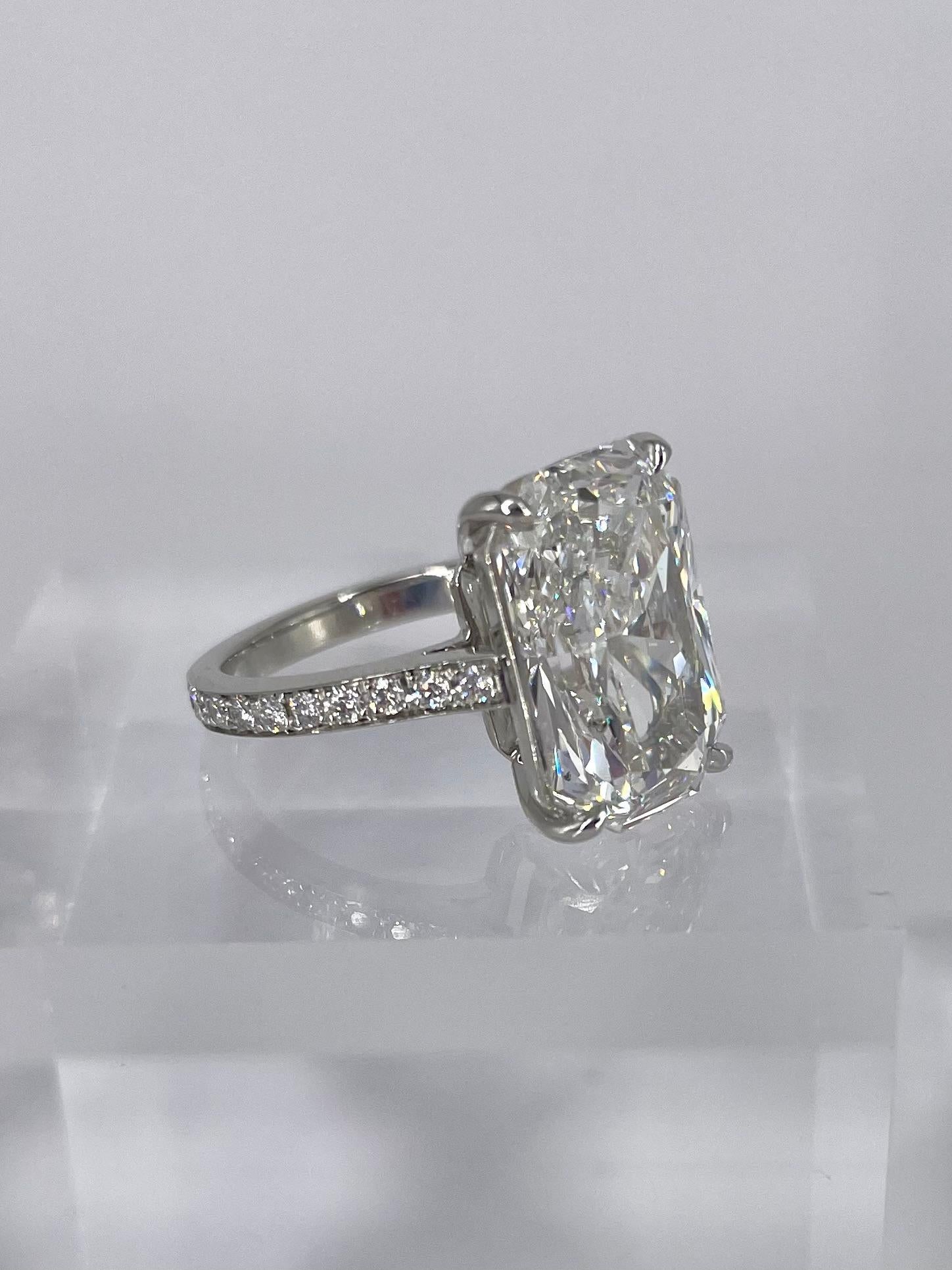 This sophisticated ring is sleek, modern and definitely makes a statement! It features a 7.80 carat radiant diamond that has an exceptionally elongated shape, which is very difficult to find. The diamond is certified by GIA to be F color and SI2