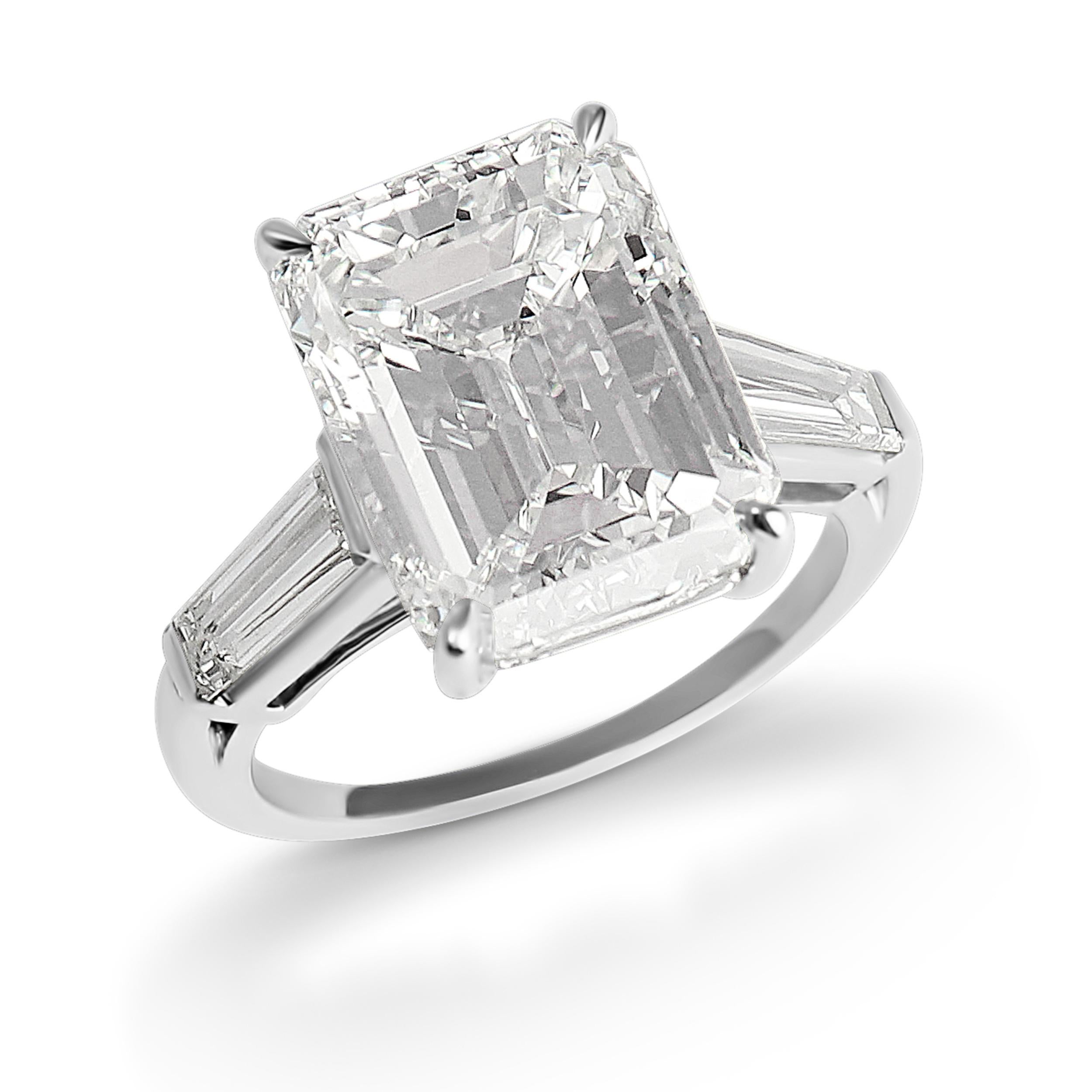 This classy J. Birnbach ring features a 8.01 carat emerald cut diamond with I color and VS2 clarity set in platinum between two tapered baguettes of a total weight of 1.00 carat. The Emerald cut of the center stone gives to this ring a timeless and